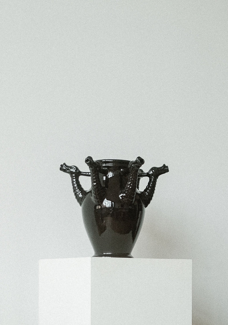 The Drago Nero - Minimalist Vase in Ceramic — front view on white pedestal