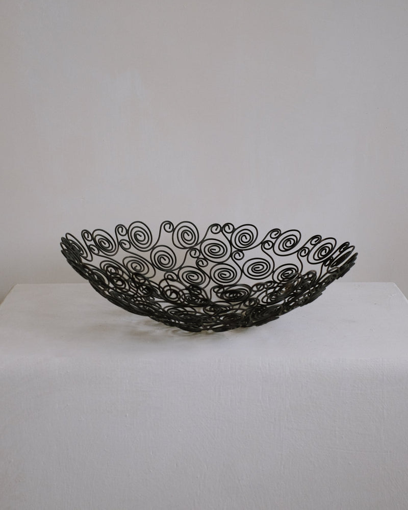 Black wire decorative bowl with spiral pattern openwork design