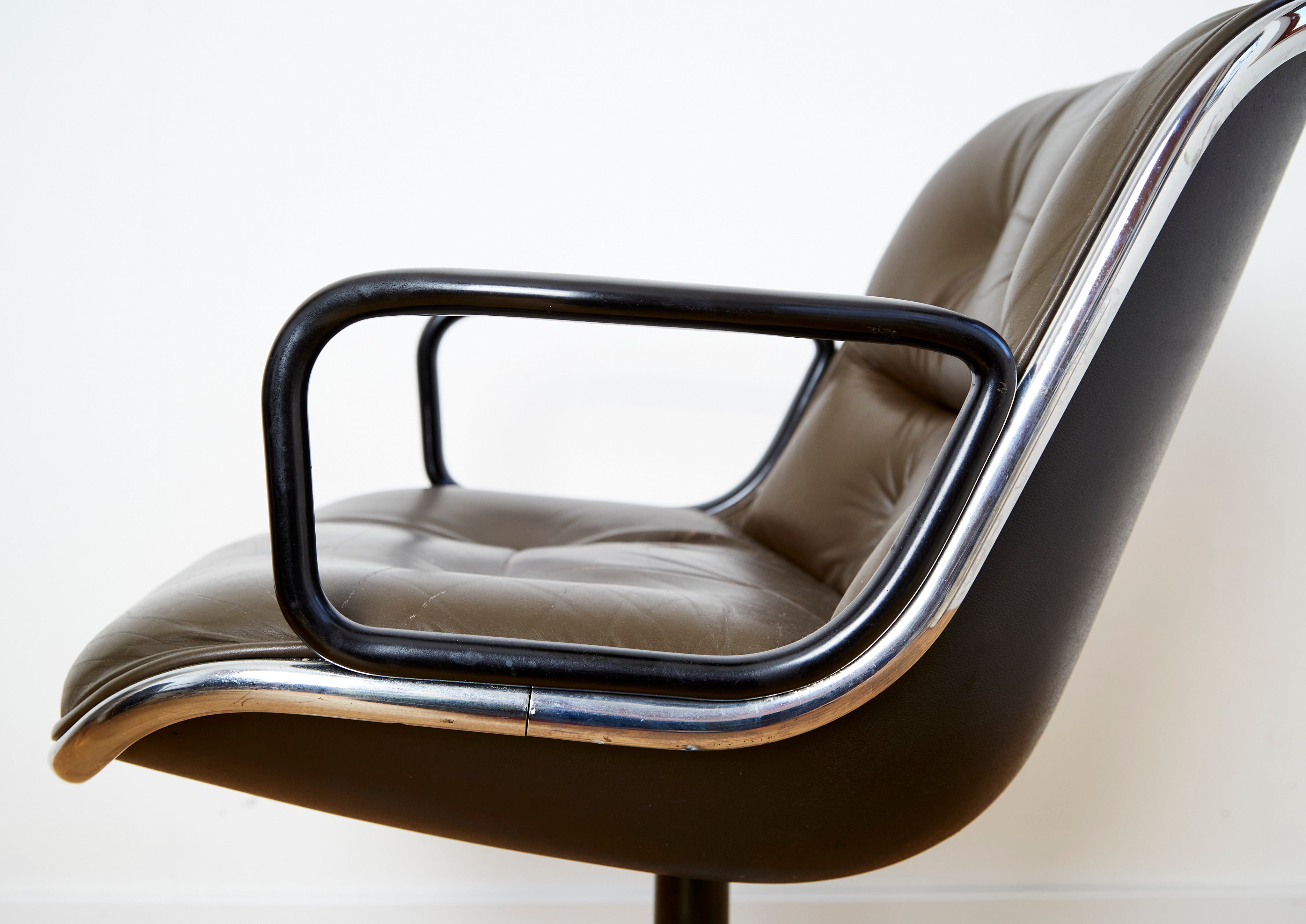 Charles Pollock "Executive Chair" for Knoll International — side view of brown leather seat with chrome armrests