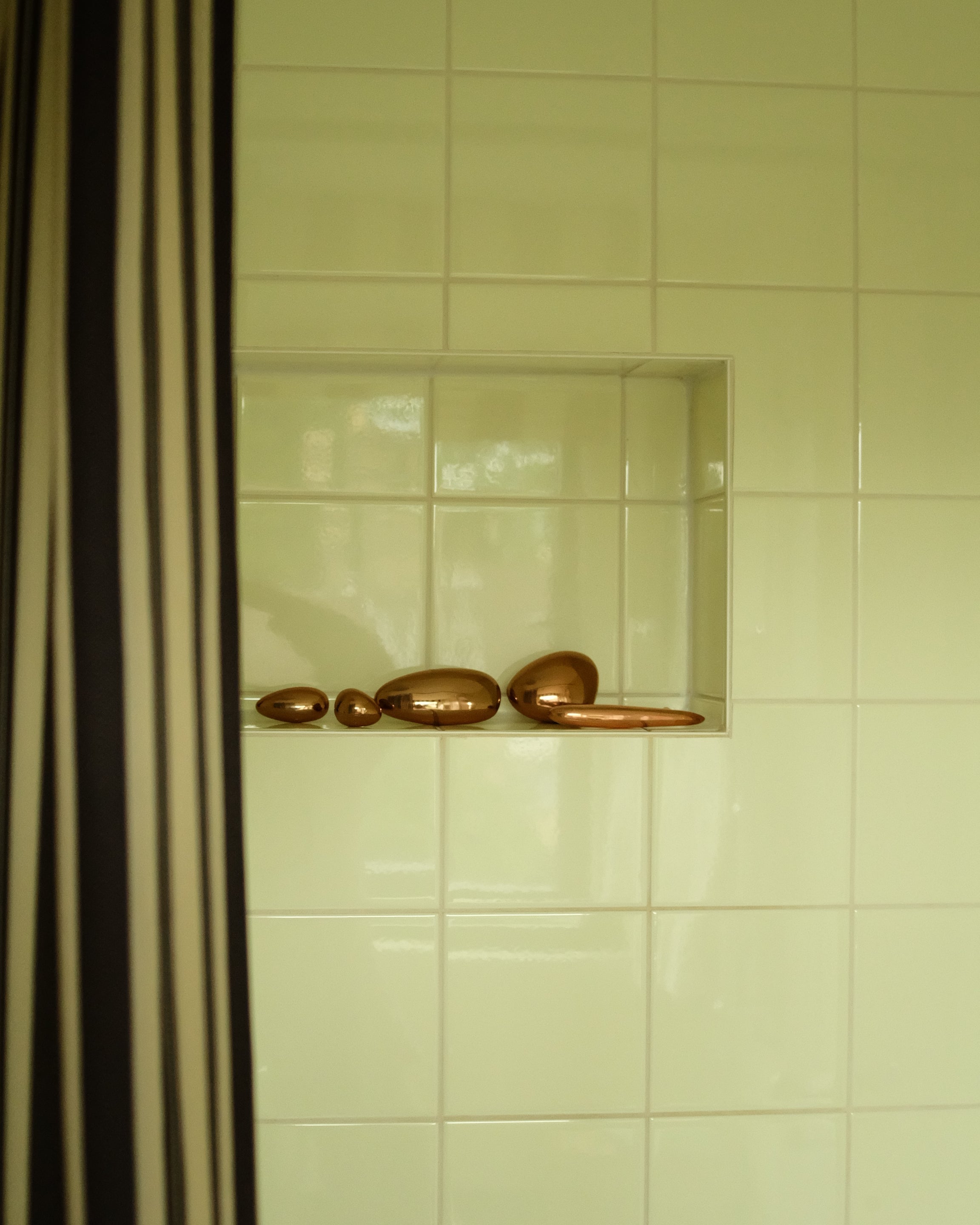 MOMI Cabinet Pull — side view of polished brass knobs on shelf