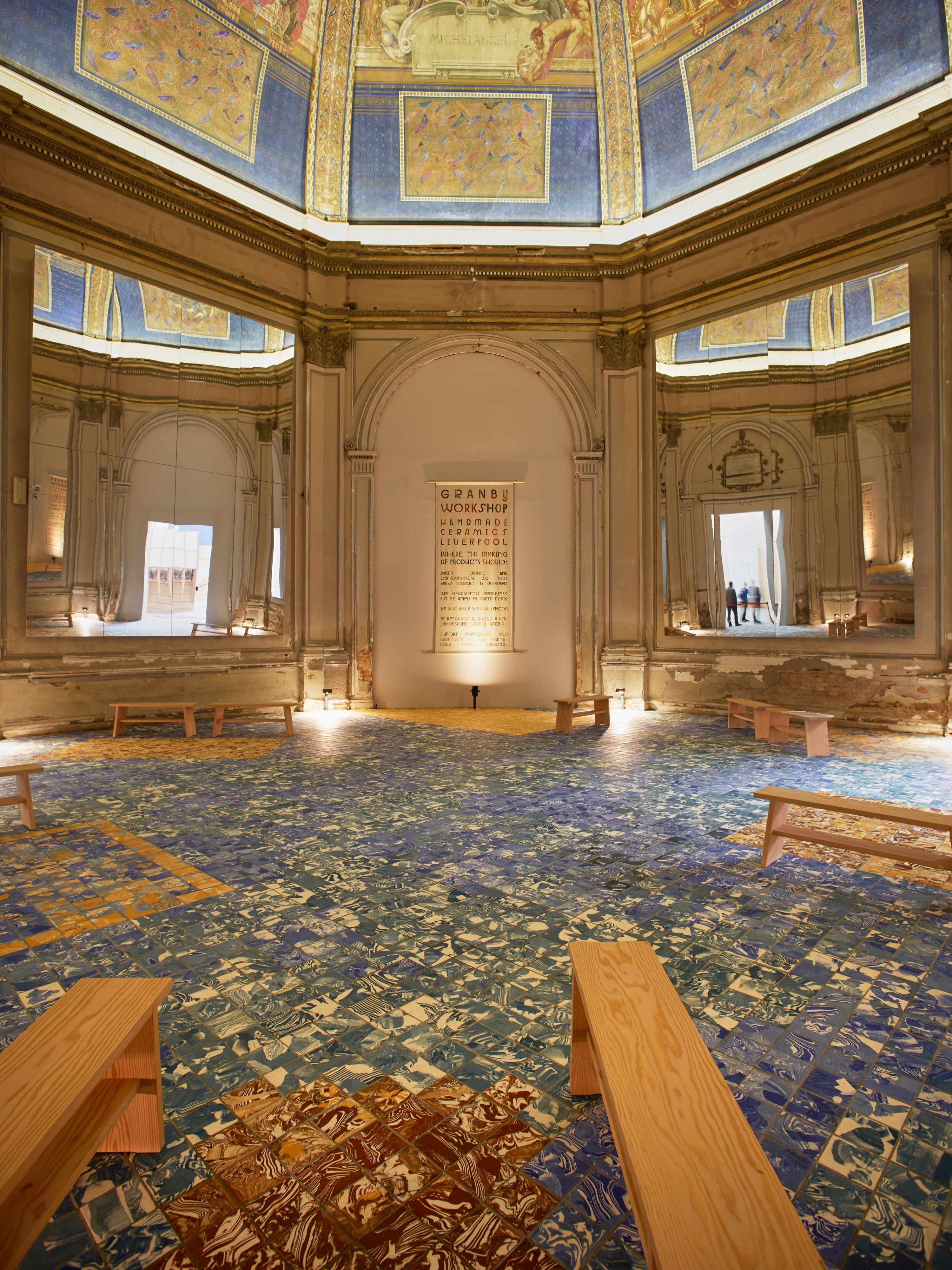 A' Bench — arranged in historic interior with patterned floor
