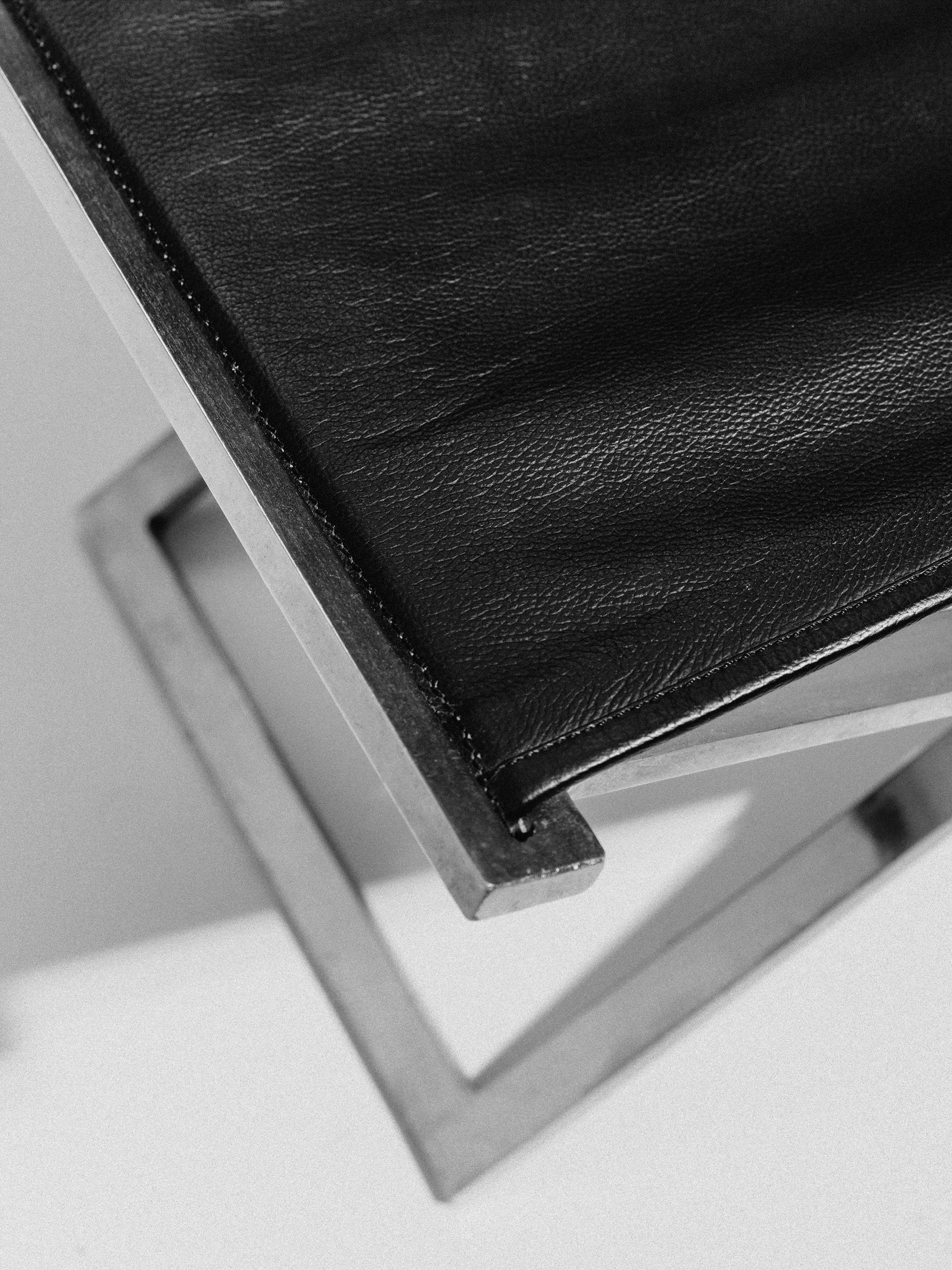 Rough #1 Folding Stool, Steel and Leather, Danish Modernist, Late 20th Century — lifestyle setting