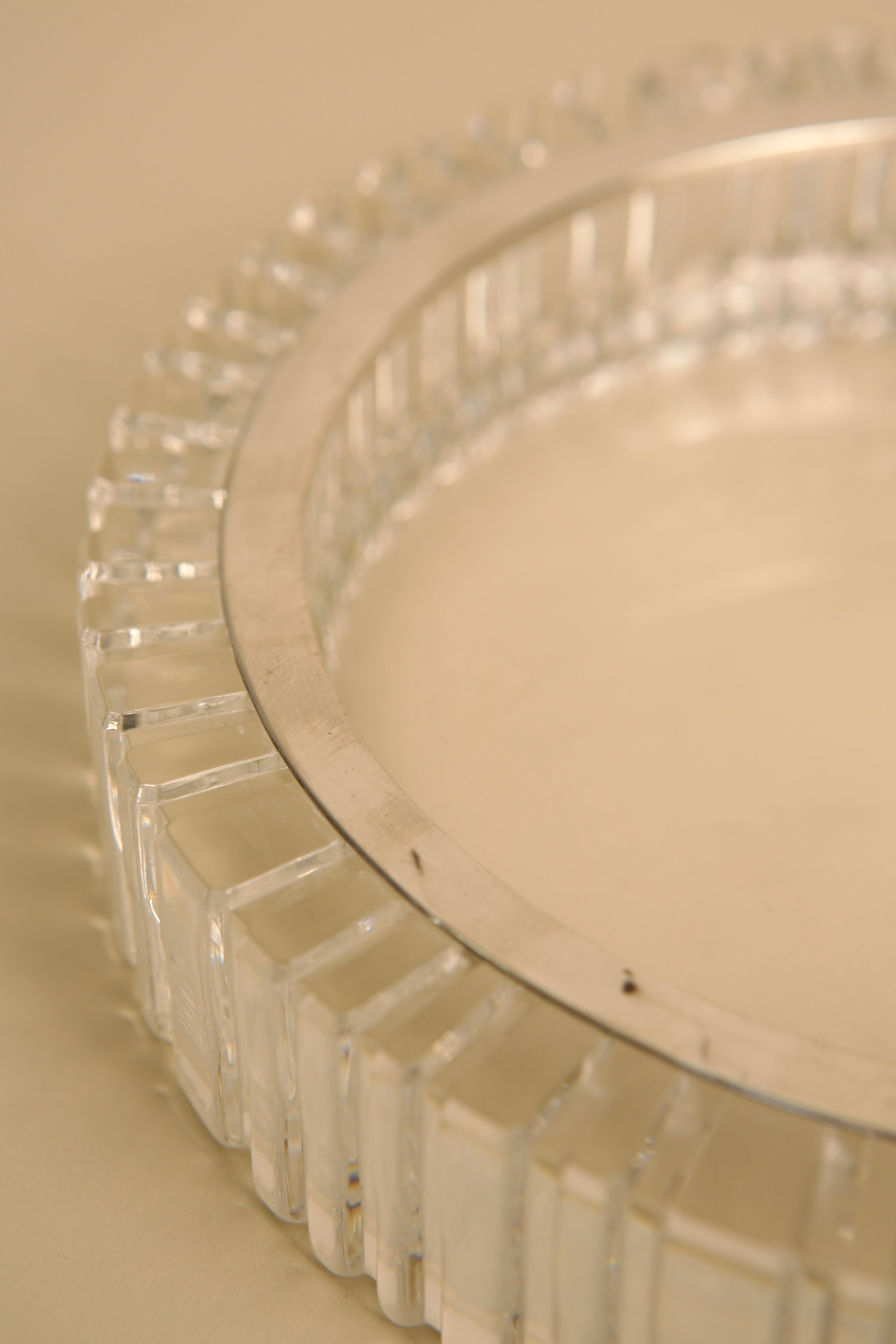 Crystal vide-poche rim detail showing geometric cut pattern