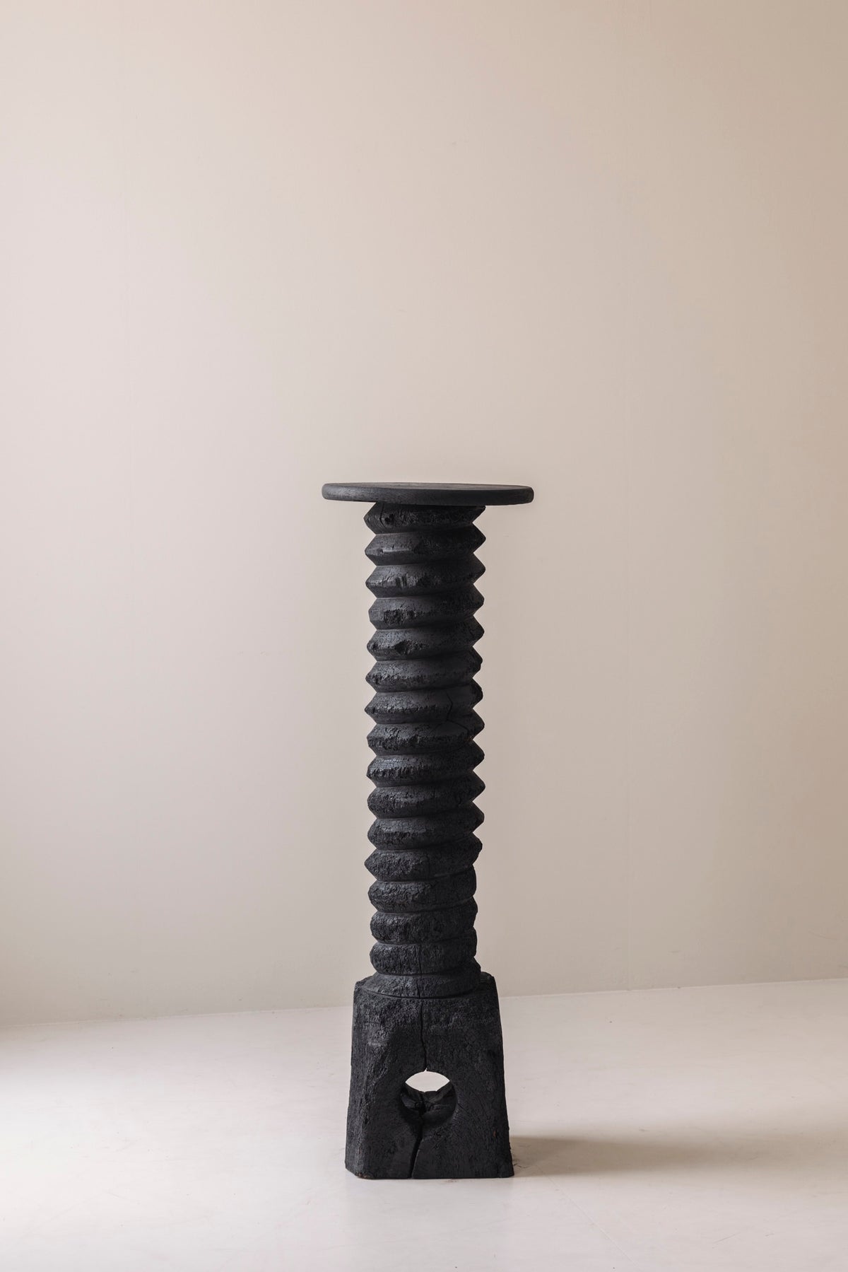 Antique French wine press screw pedestal in burned oak, 19th century. — lifestyle setting