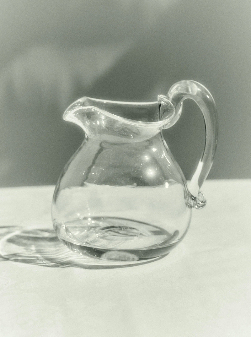 Blixen Jug — close-up of clear glass pitcher on table
