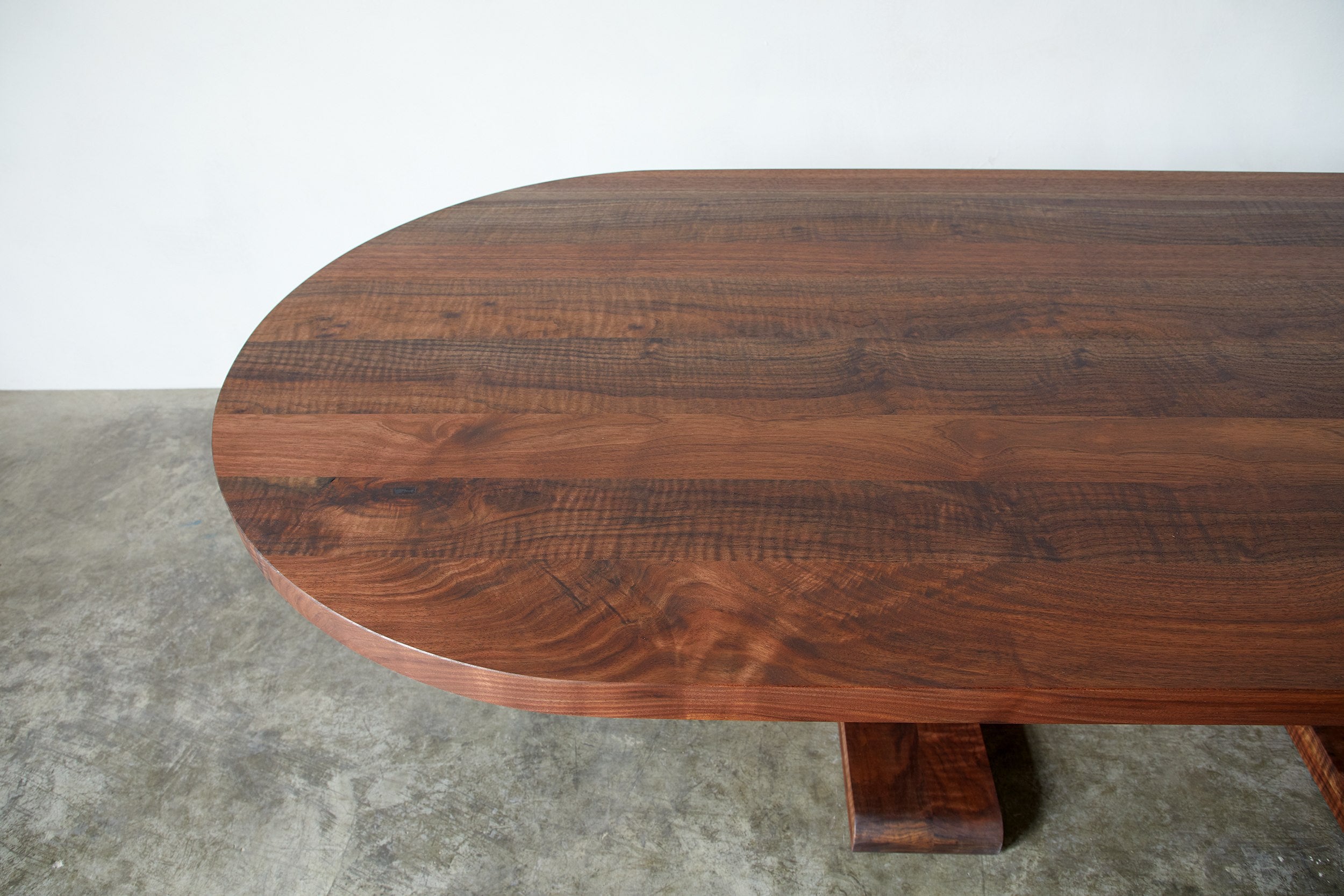 Alpen Long Dining Table — top view of rich walnut wood surface