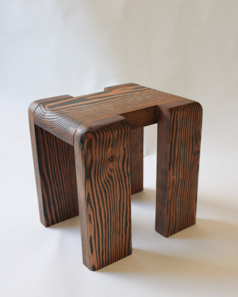 Modern douglas fir milking stool with curved grain pattern