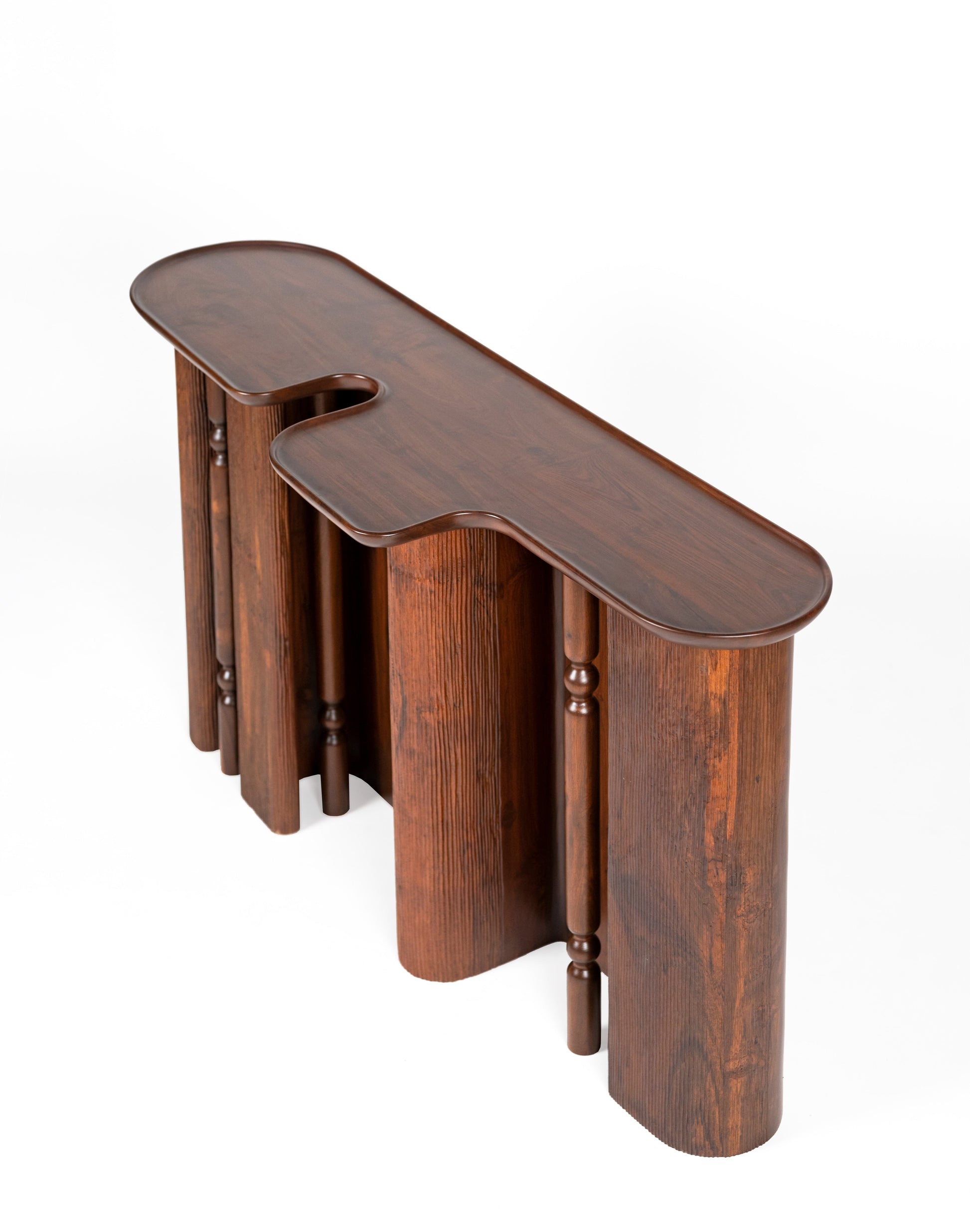 Ridge Console Table — top view of dark wood with curved edges