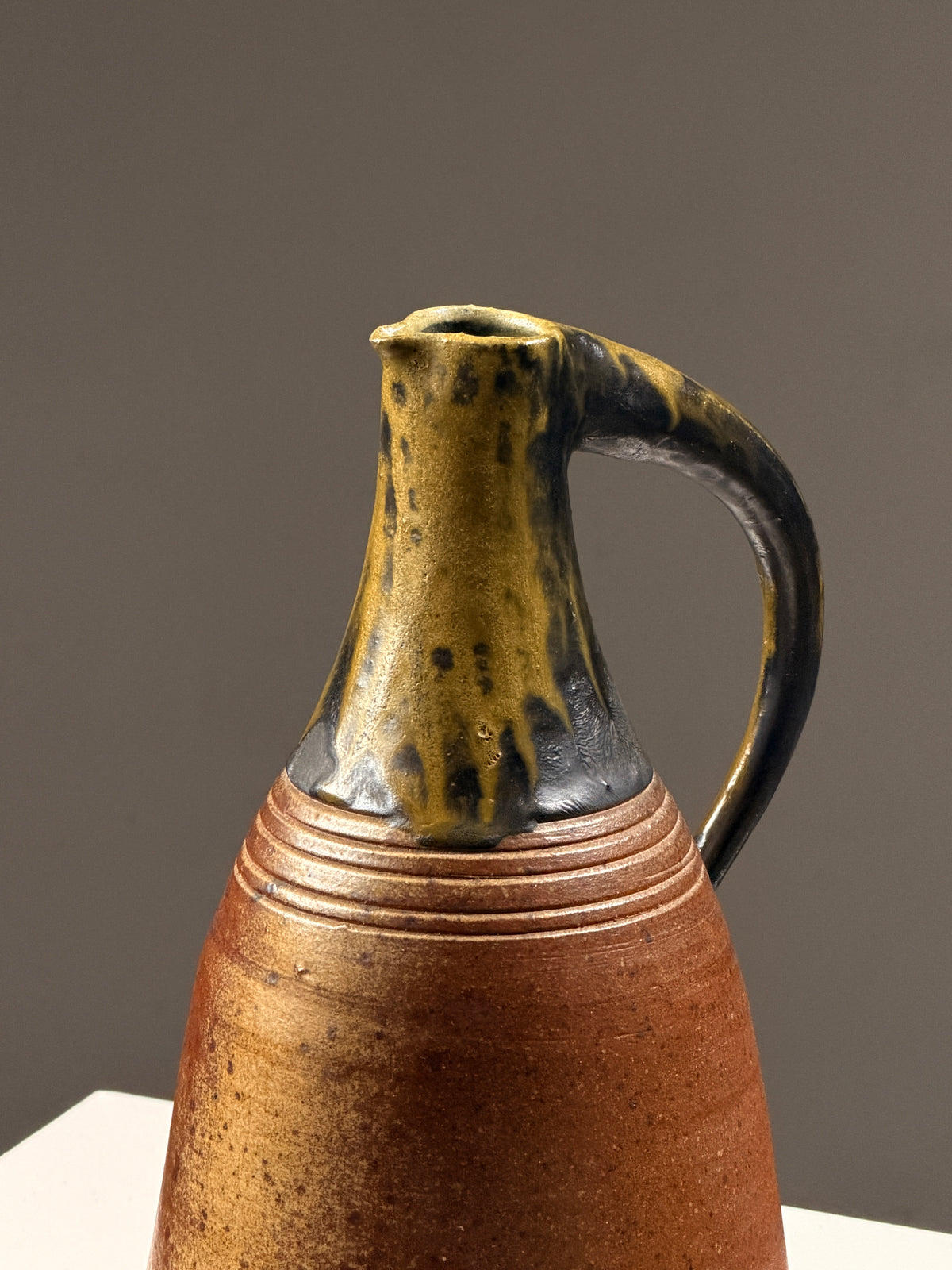 Large sculptural glazed stoneware pitcher, circa 1970 — lifestyle setting