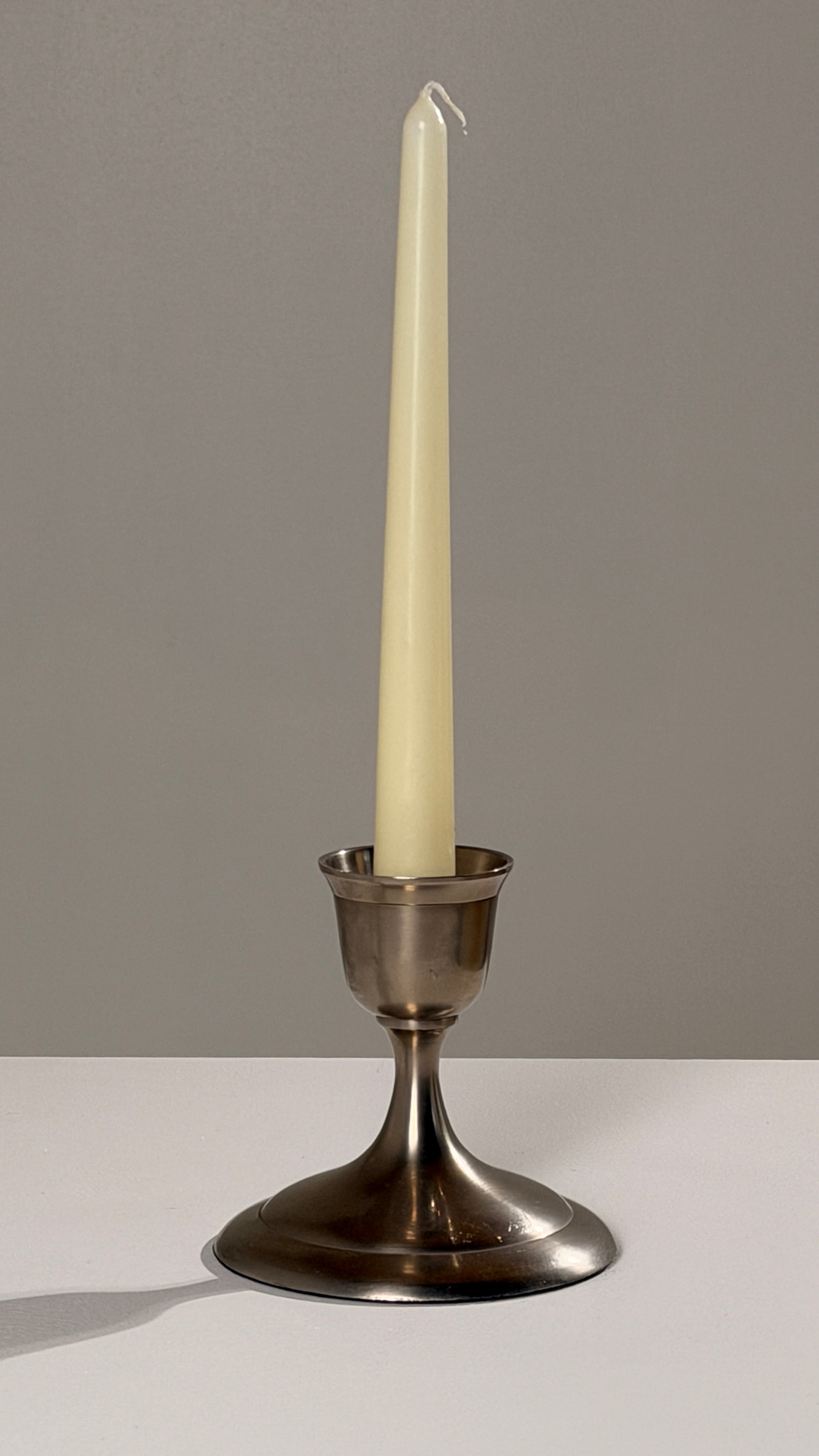 Silver-plated Metal Candleholders, France, circa 1930 — side angle with cream candle