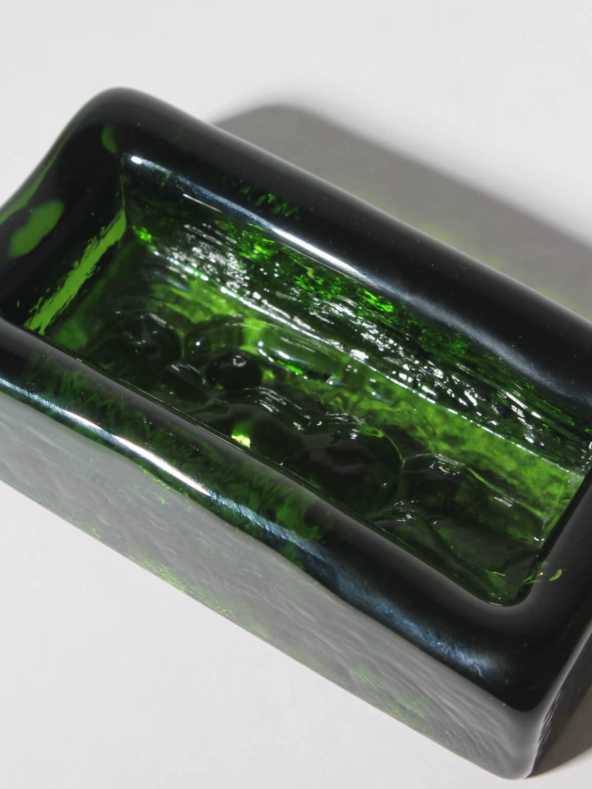 Erik Höglund Nude Female Relief Art Glass Bowl — angled view highlighting green glass texture