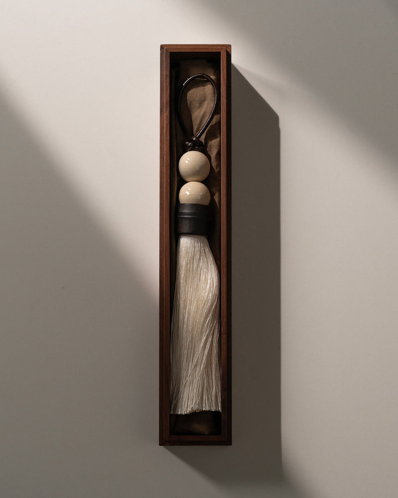 Traditional Chinese calligraphy brush tassel ornament in wooden display box