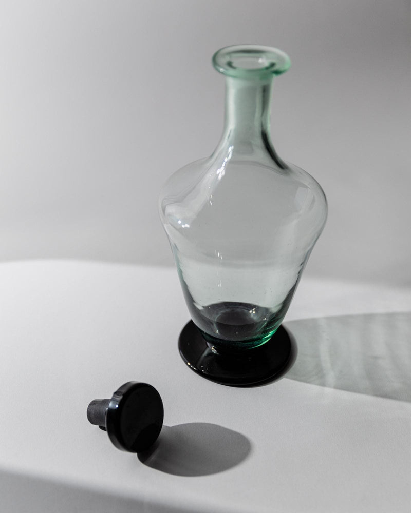 1960s Murano Glass Decanter — close-up of clear glass with black base