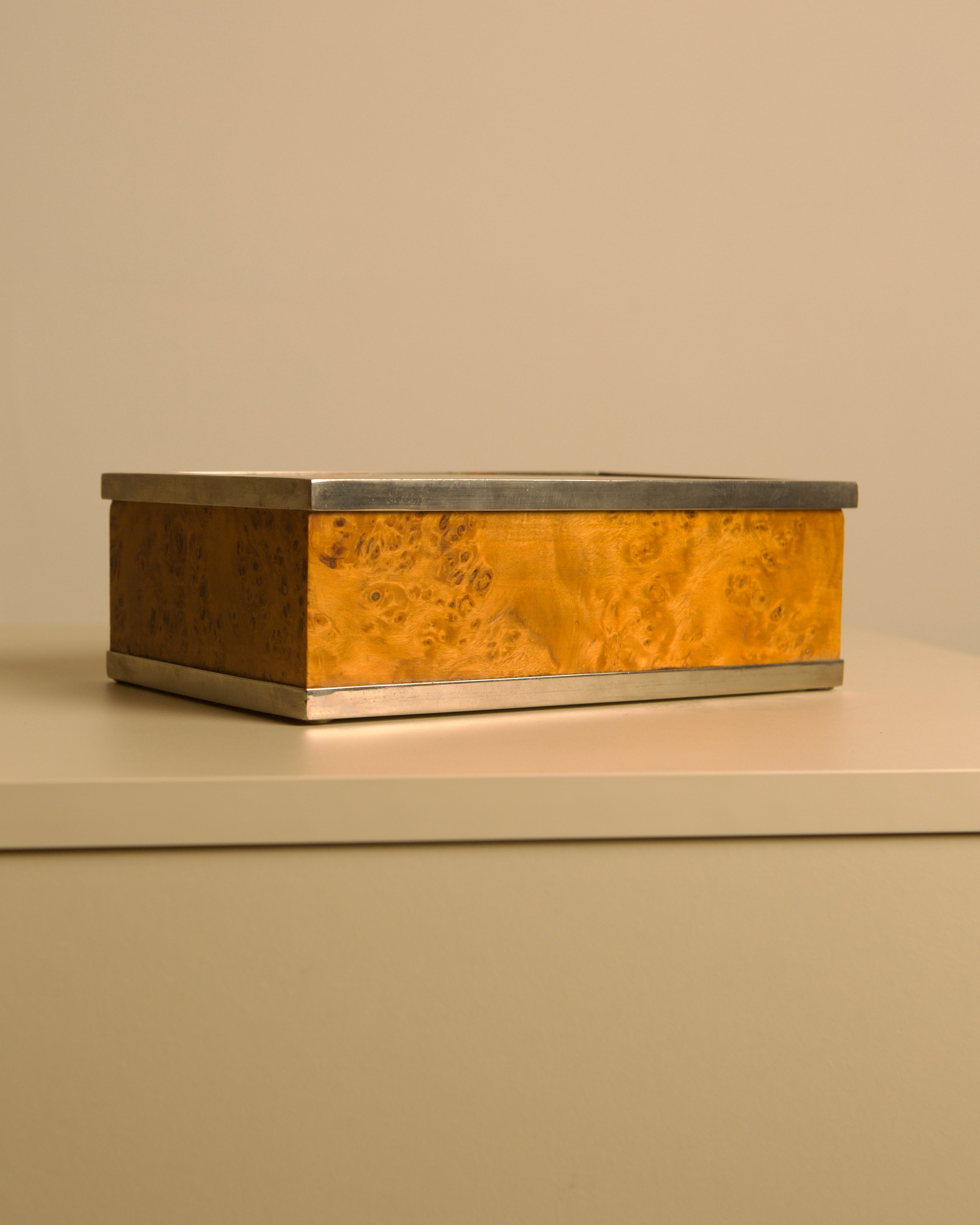 Italian Box in Poplar Burl Wood and Metal, 70s — angled view on neutral surface