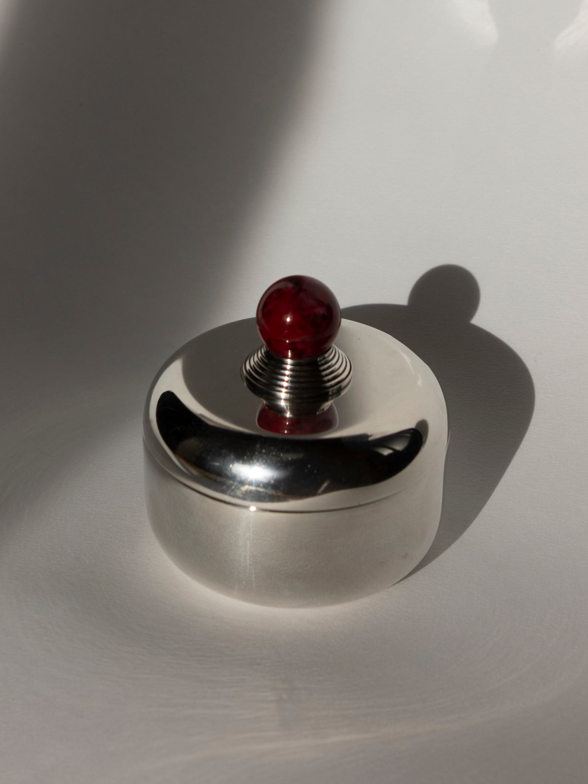 Puiforcat French Art Deco Box with Ruby Red Lacquer Finial — lifestyle setting