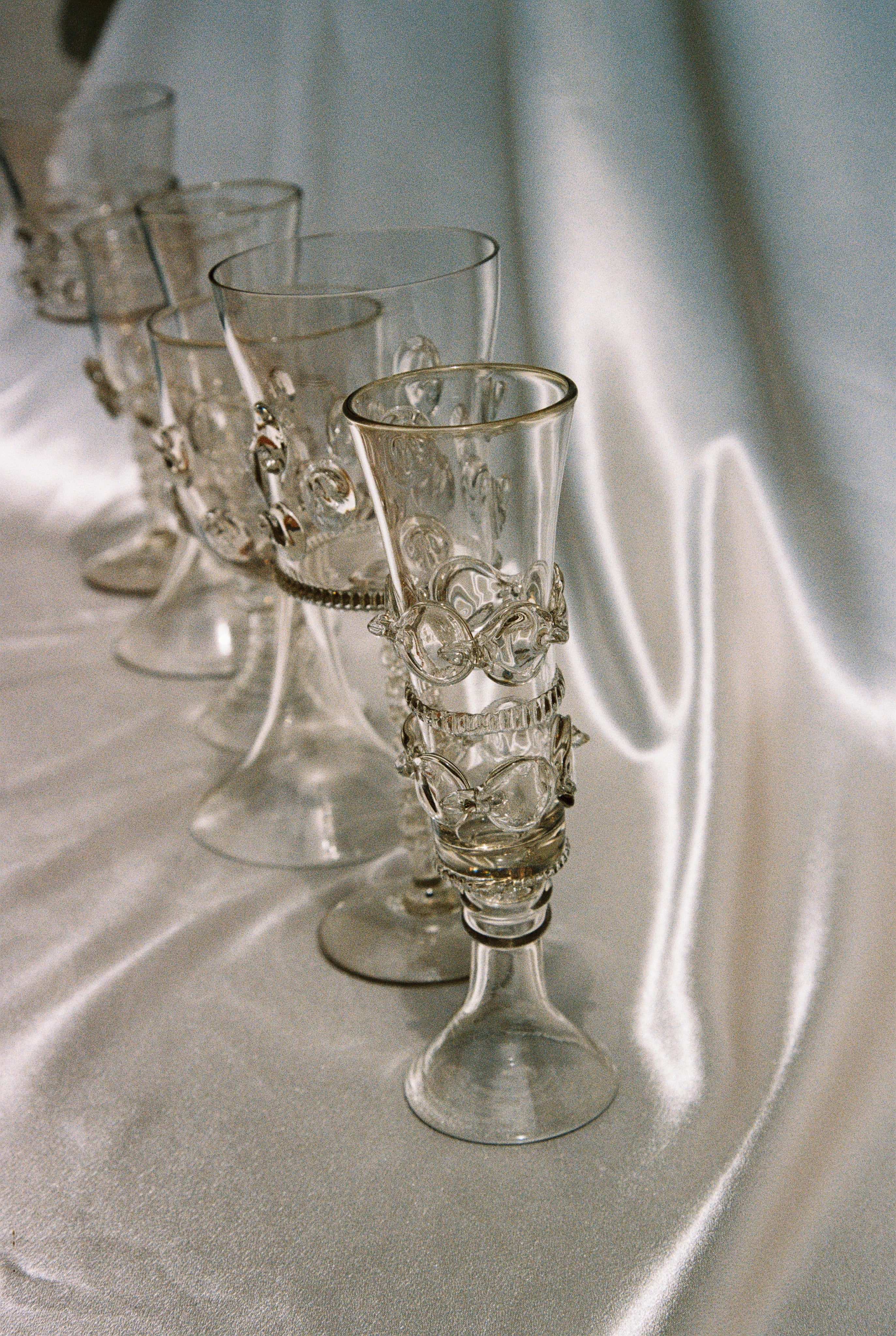 Set of six Mouthblown Wine Glasses — top view on satin fabric