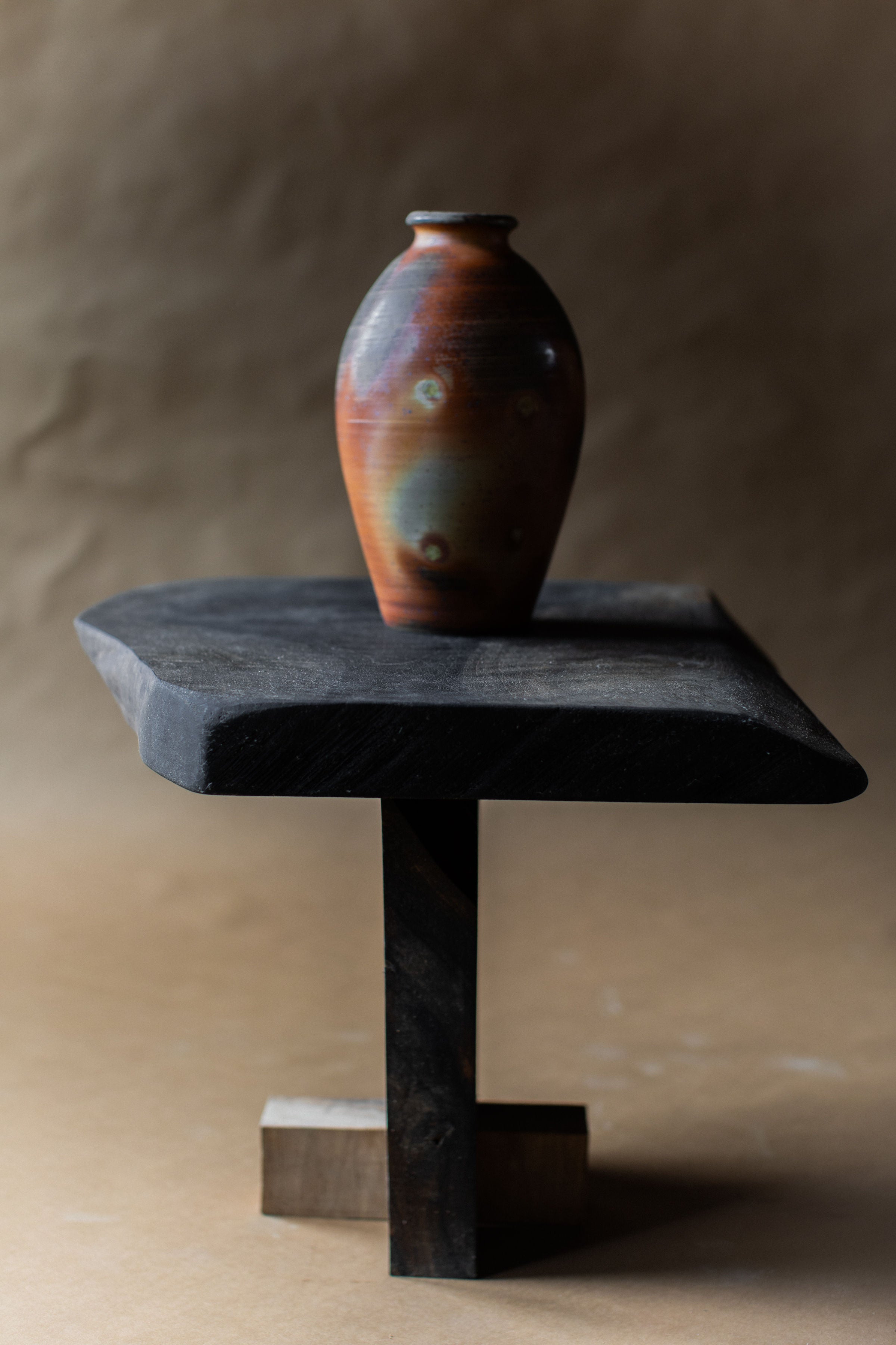 Vintage Ceramic Vase — top view on black wooden table