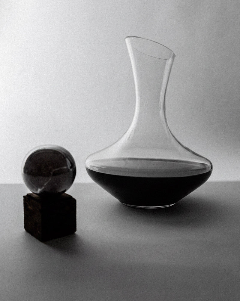1990s Wine Decanter — close-up of clear glass with dark wine