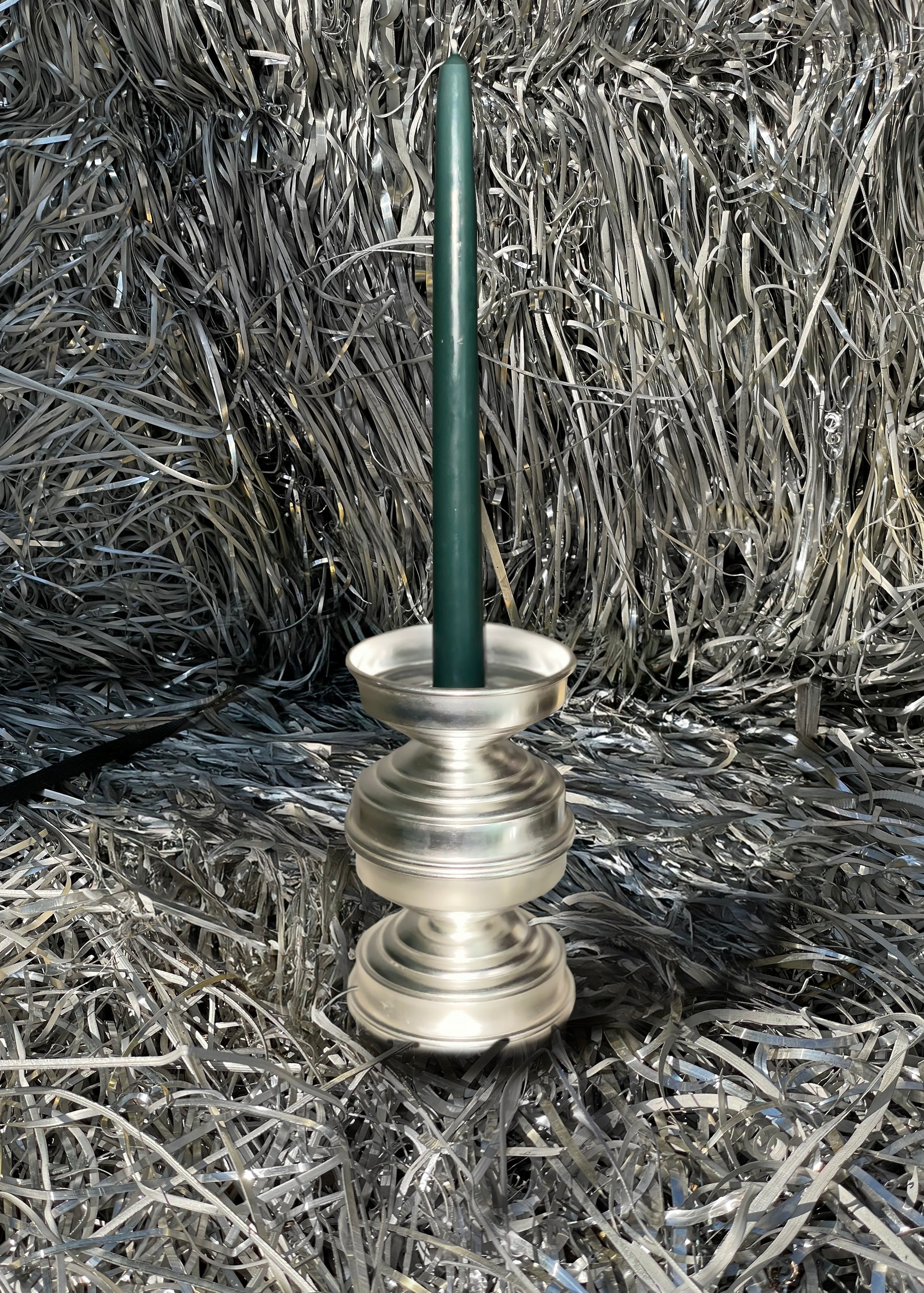 Silver Plated Candle Holders in Brass — angled view on metallic background