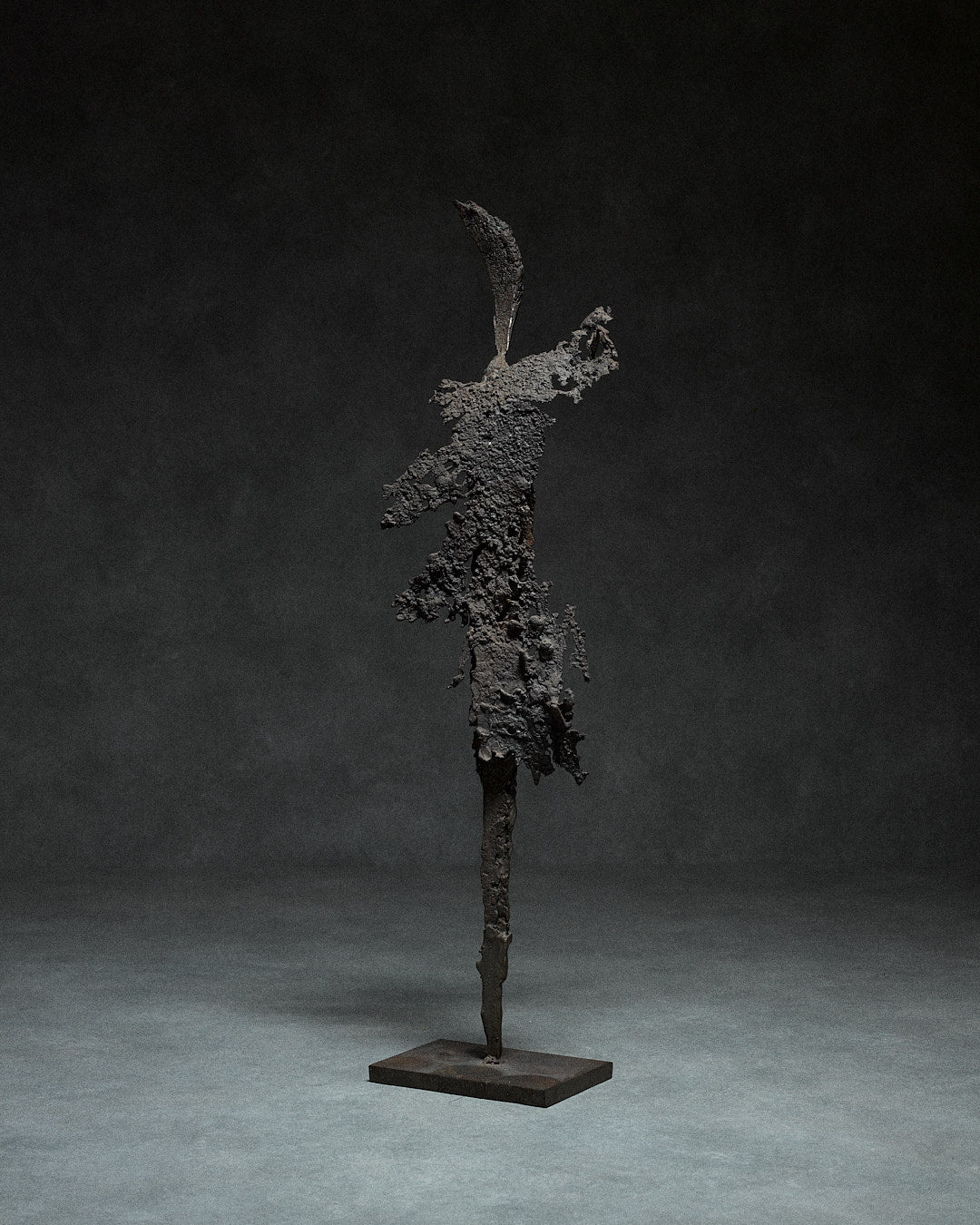 Skeletal Sculpture in Iron by Francois Saison — side view highlighting textured surface