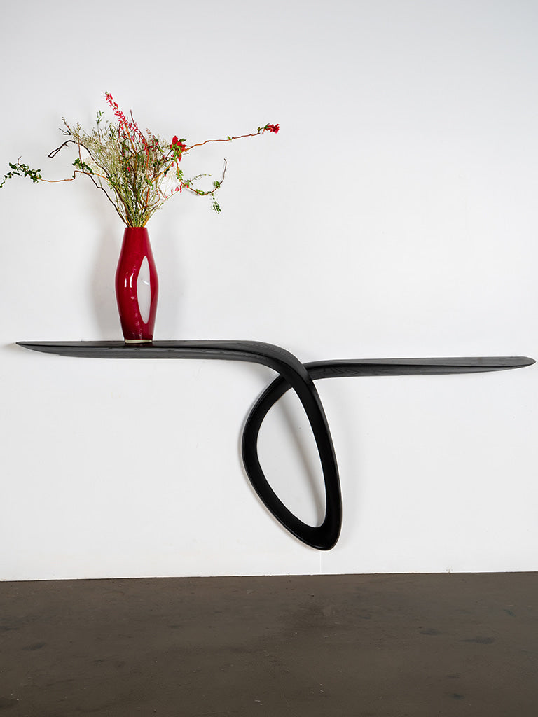 Sculptural Giv Wall Mounted Console Table in Ash wood Ebony stain — detail view