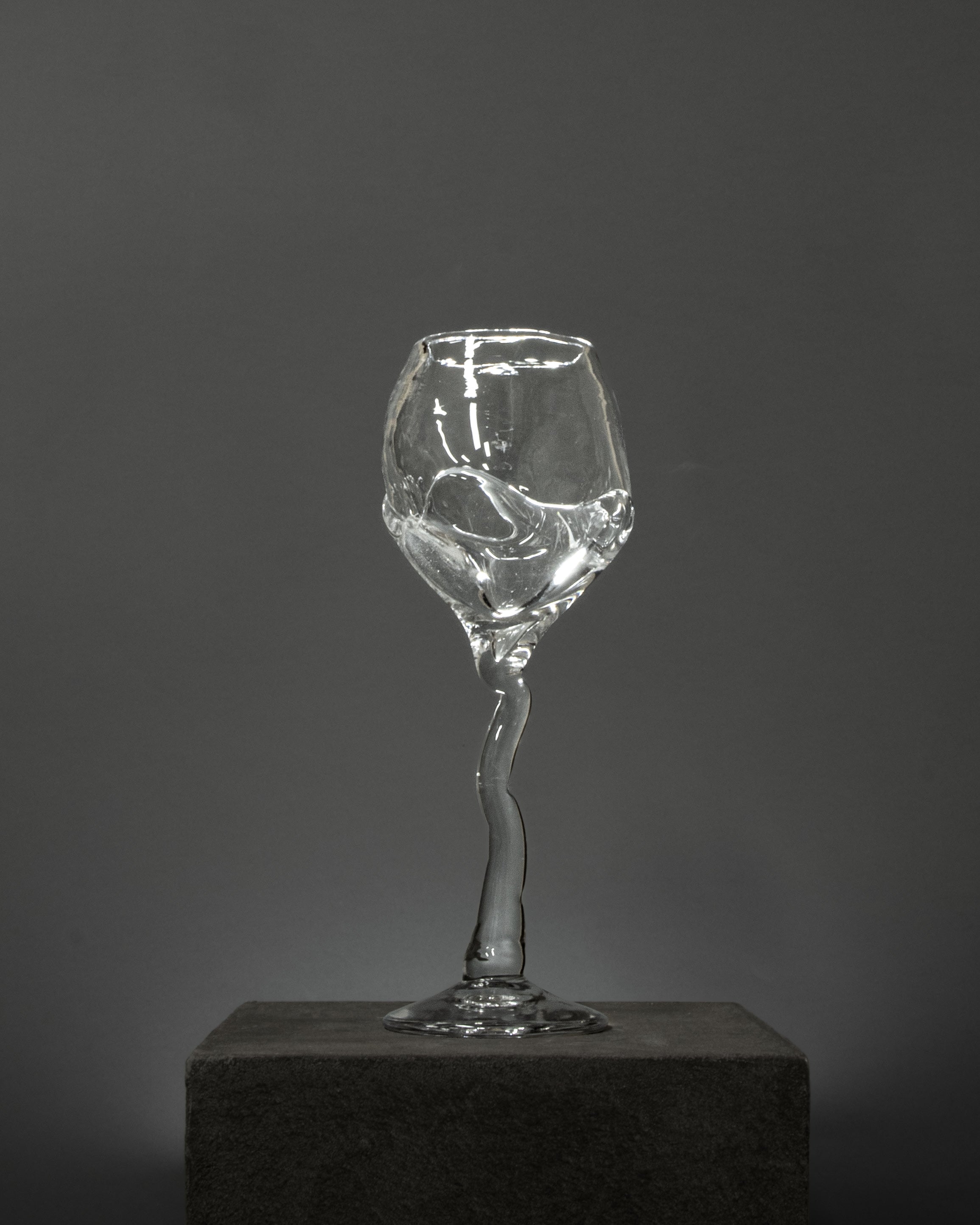 Hand-blown Wine Glass — close-up of clear glass with twisted stem