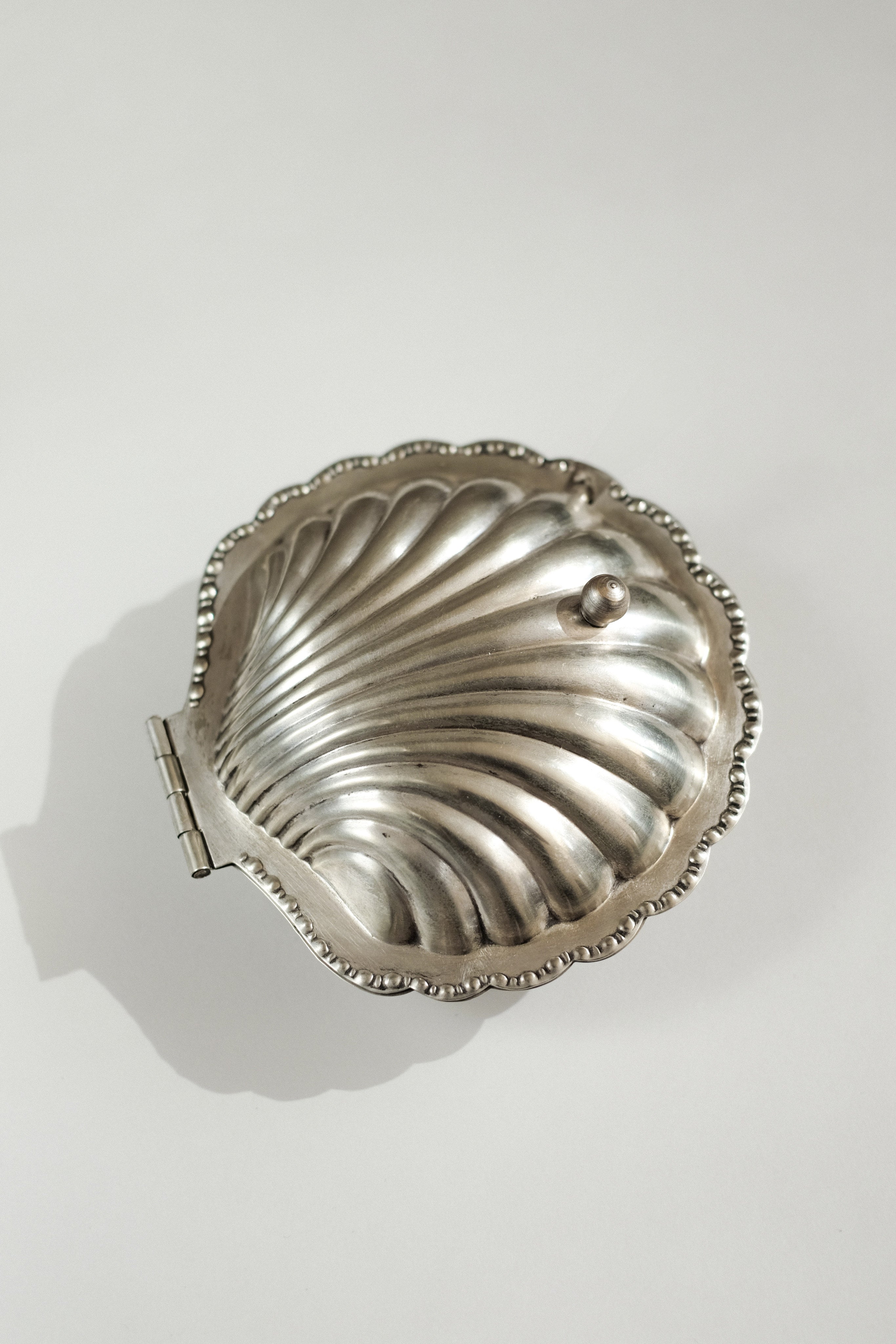 Shell Shaped Butter Dish — top view of silver dish with hinge