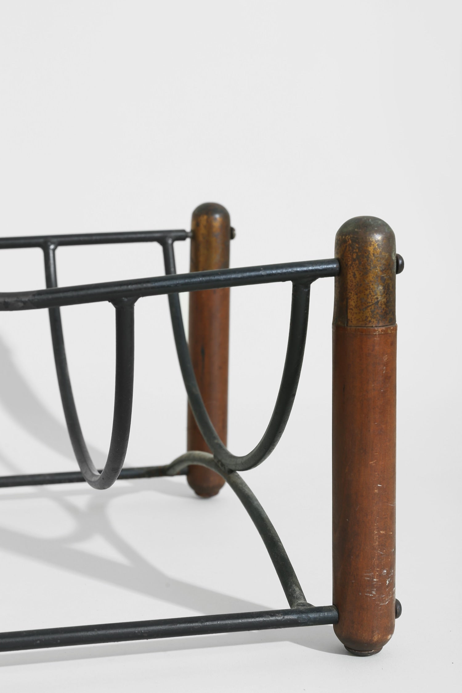 Mid-century Magazine Rack — angled view highlighting wooden and metal materials