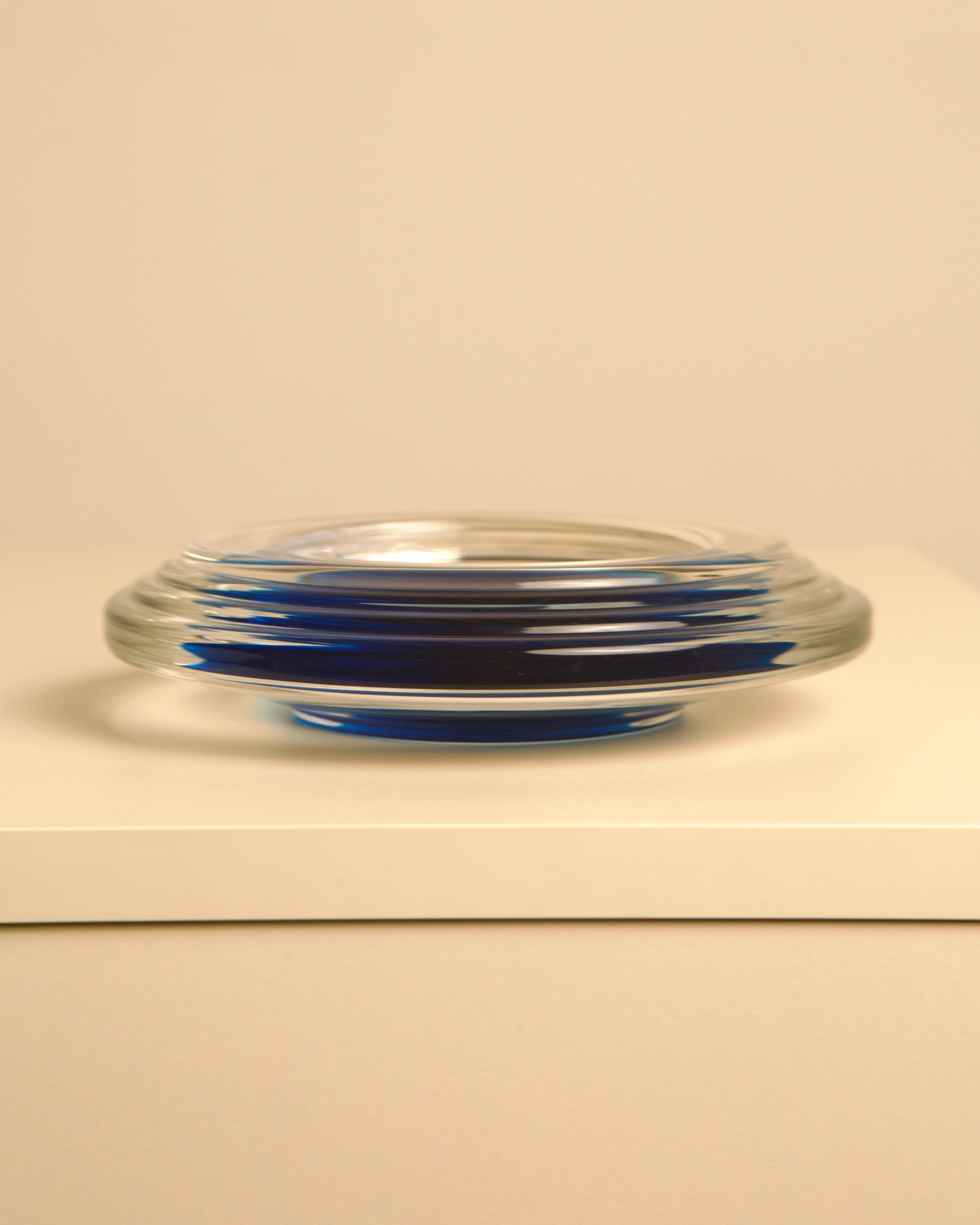 Blue Murano glass vide poche tray showing curved profile detail