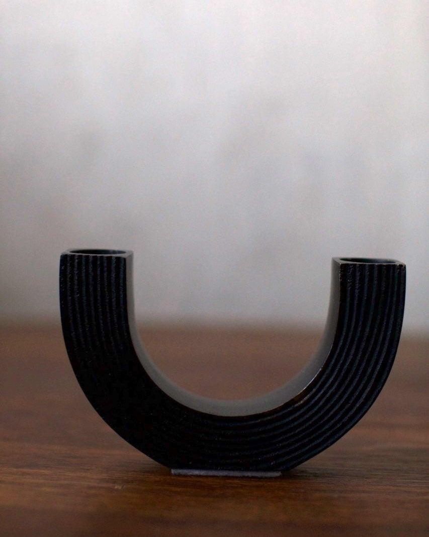 Black Steel Candleholder — side angle showing ribbed texture and base