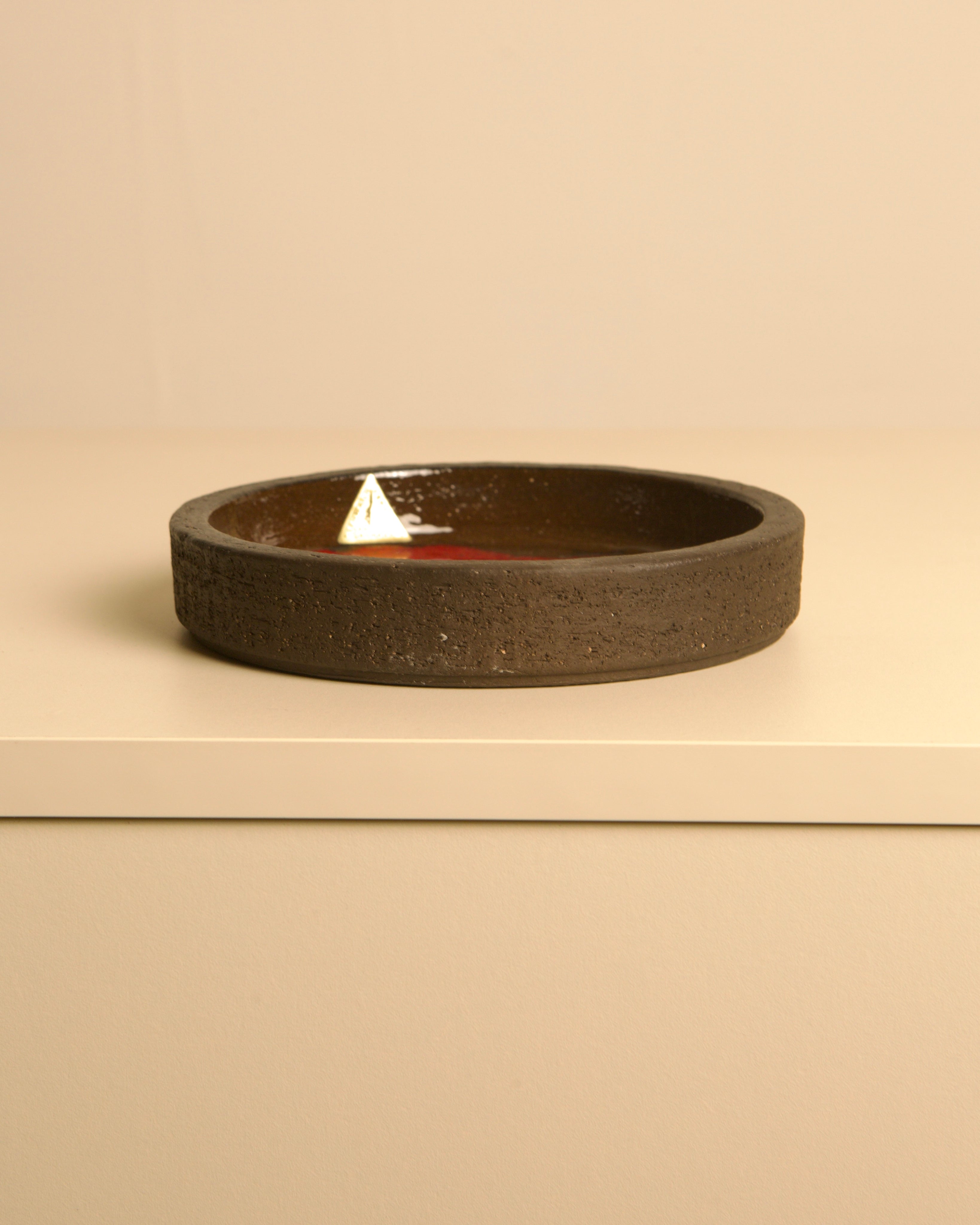 Circular Ceramic Trinket Dish by Jan Van Erp 60's — side view showing dark ceramic texture