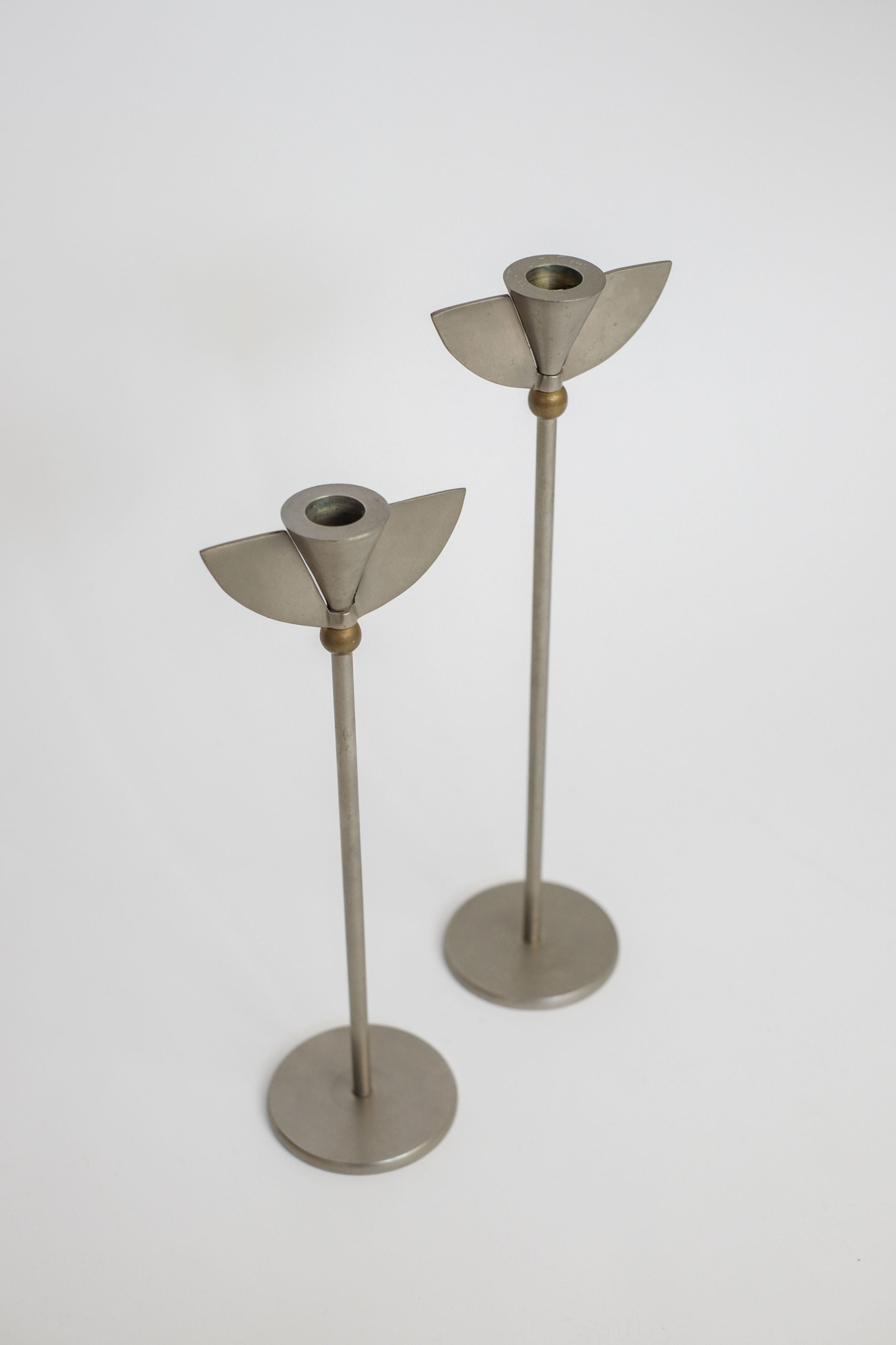 Set of 2 Memphis Candleholders — close-up of metal candleholders on white background