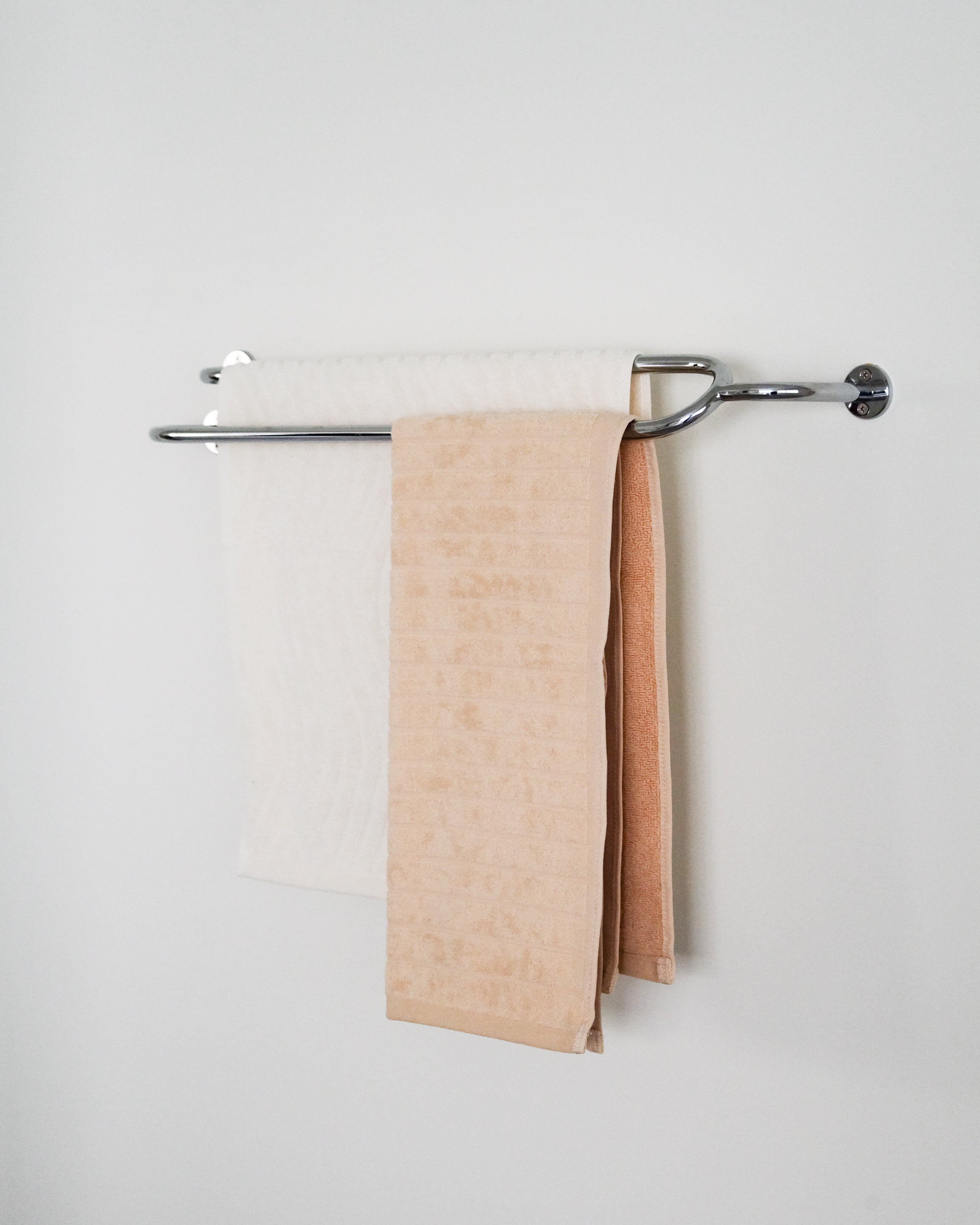 FAUNA Towel Bar Double — side angle with white and peach towels