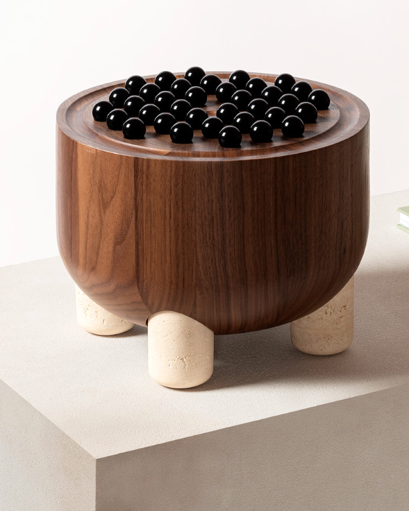 Mocambo walnut peg solitaire game with black marbles on legs