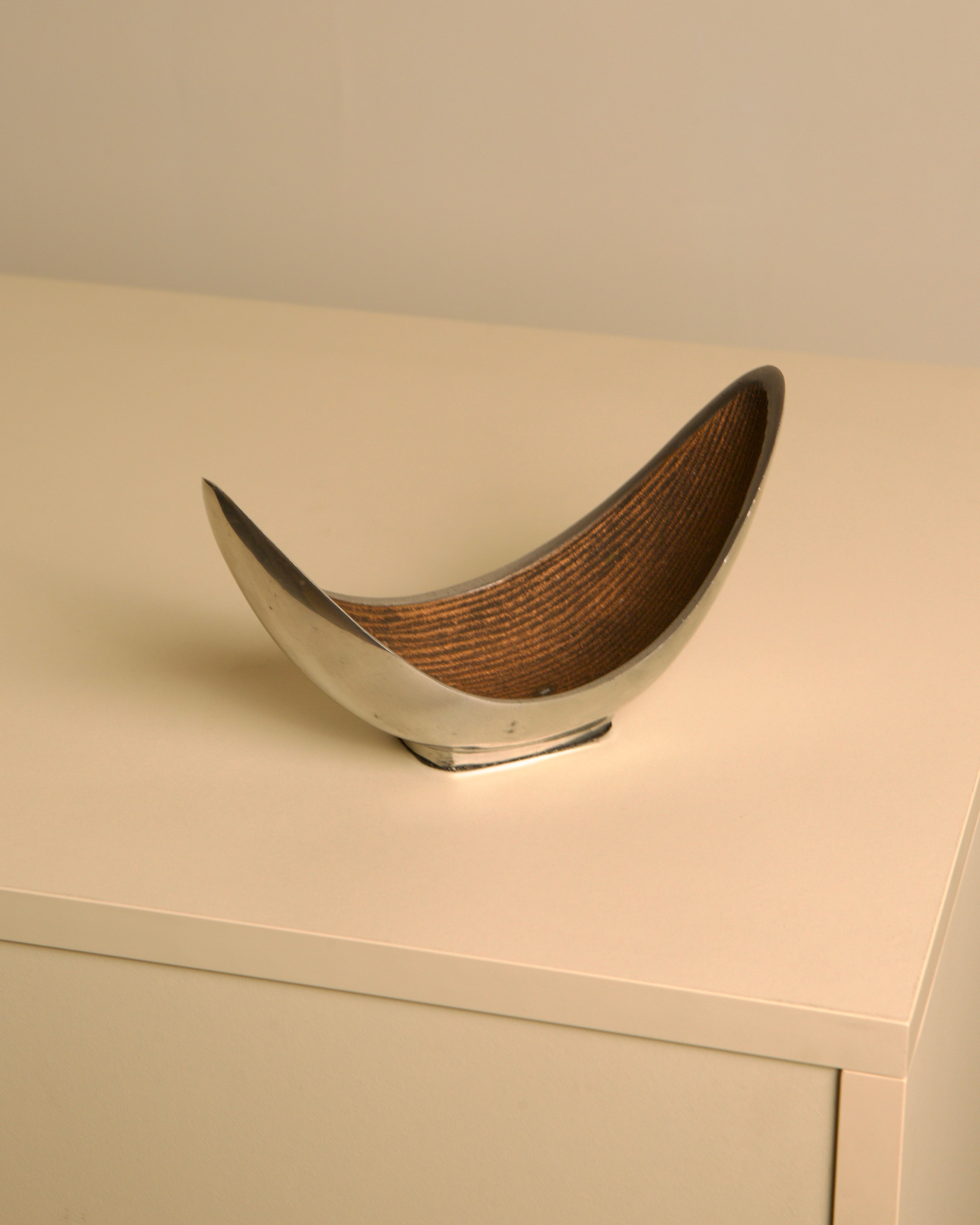 Italian "Croissant" Trinket Tray in cast al — close-up of polished metal with textured interior