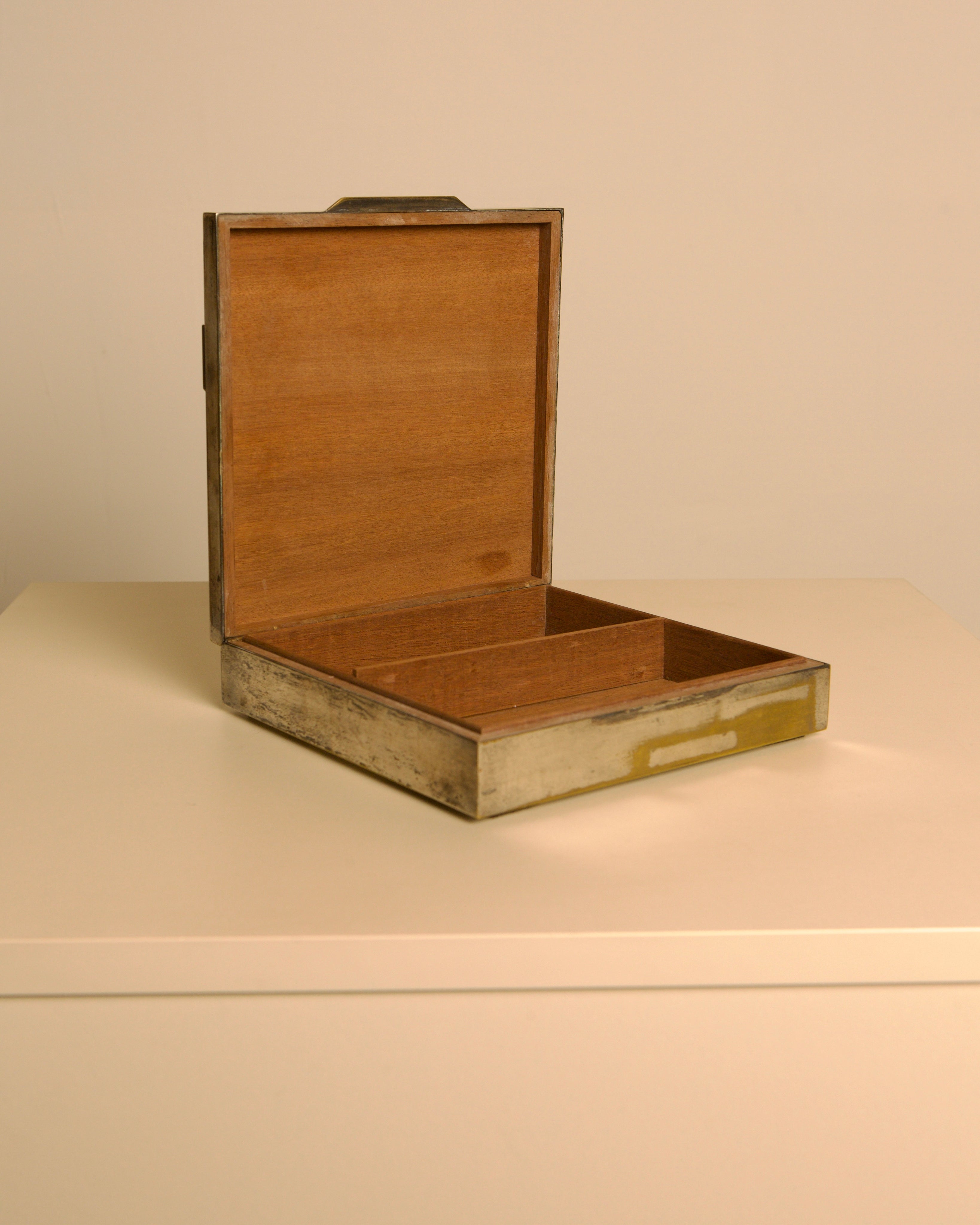 Italian patinated metal box in the style of Maria Pergay, 1950 — lifestyle setting