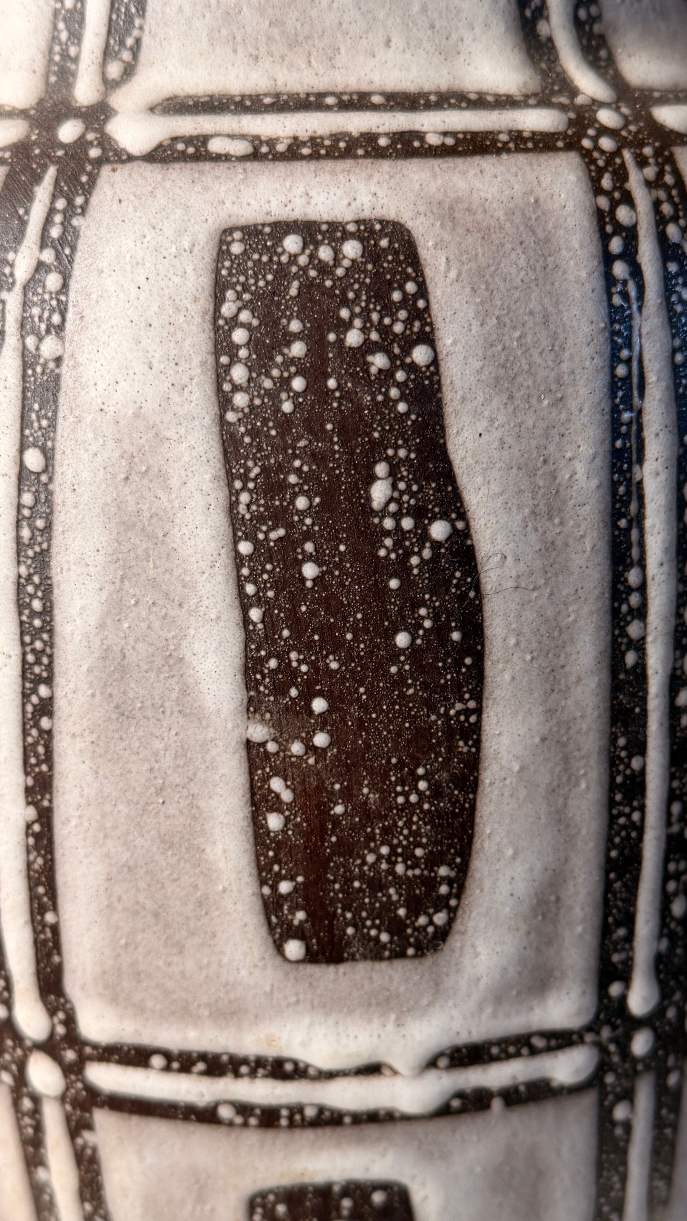 Ceramic pitcher, Germany, circa 1960. — close-up of textured ceramic surface