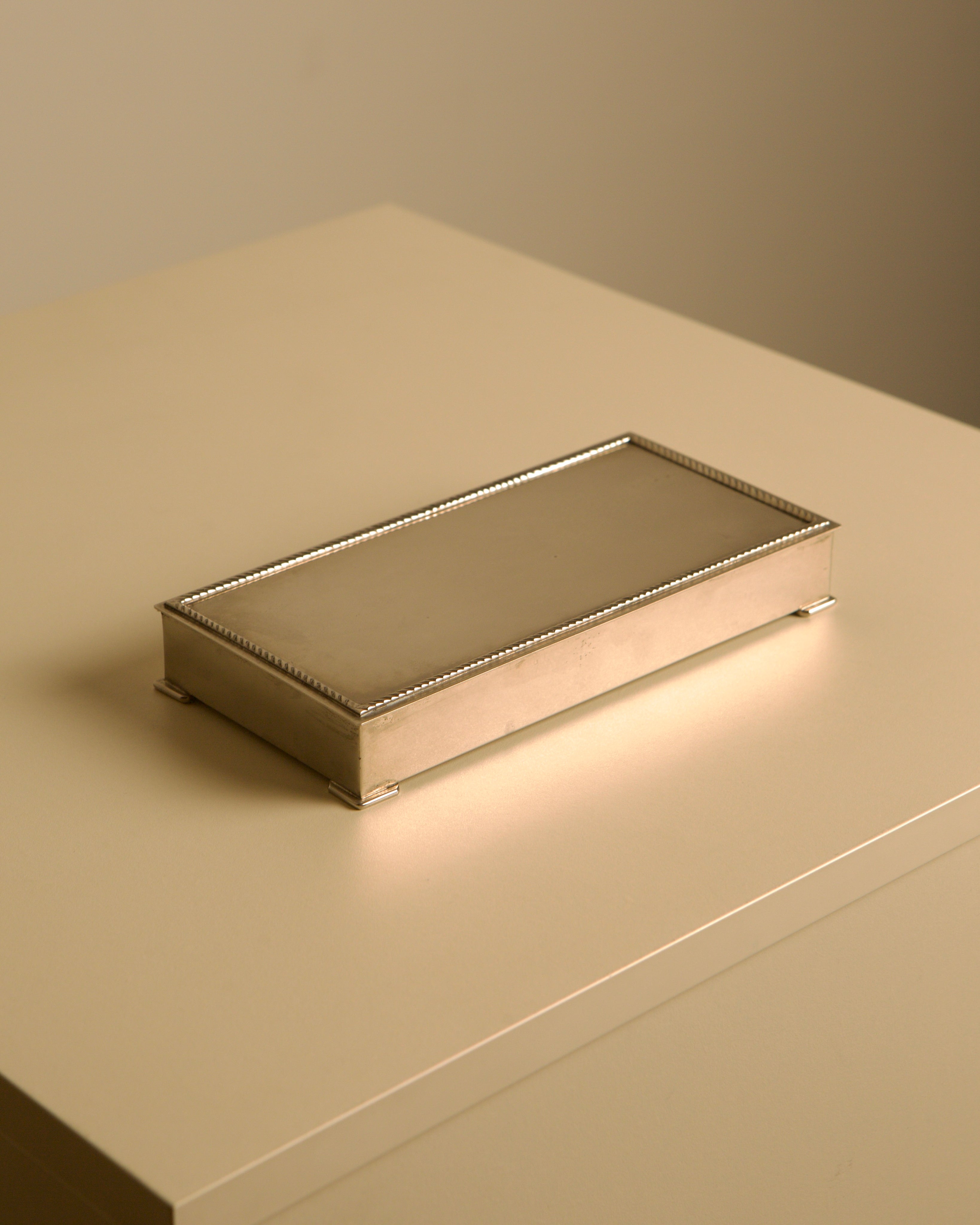 Italian Art Deco silver-plated metal and wood rectangular box, 1930s — lifestyle setting