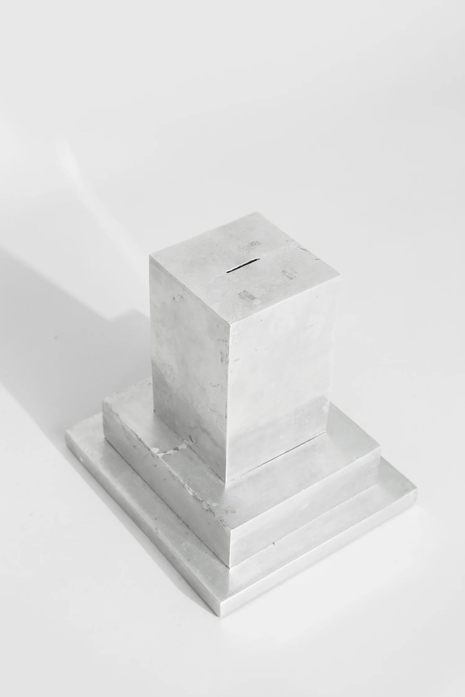 Art Deco Coin Bank — top view of polished silver surface