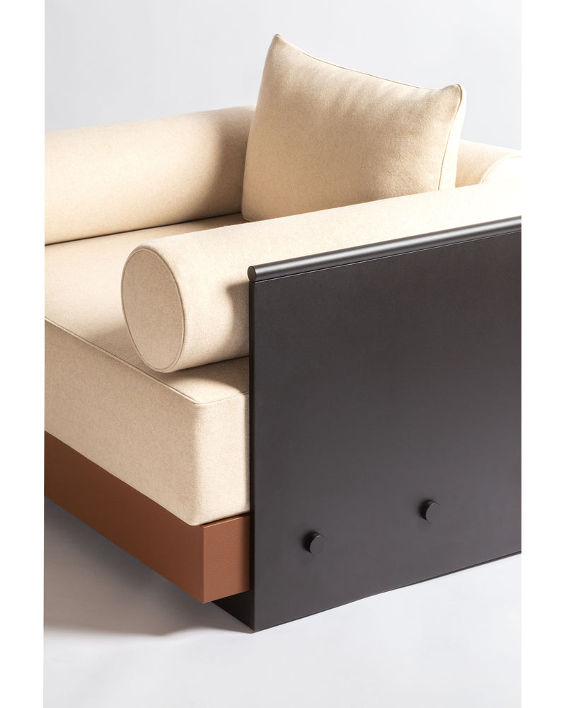 Lacan armchair detail showing beige upholstery and dark frame