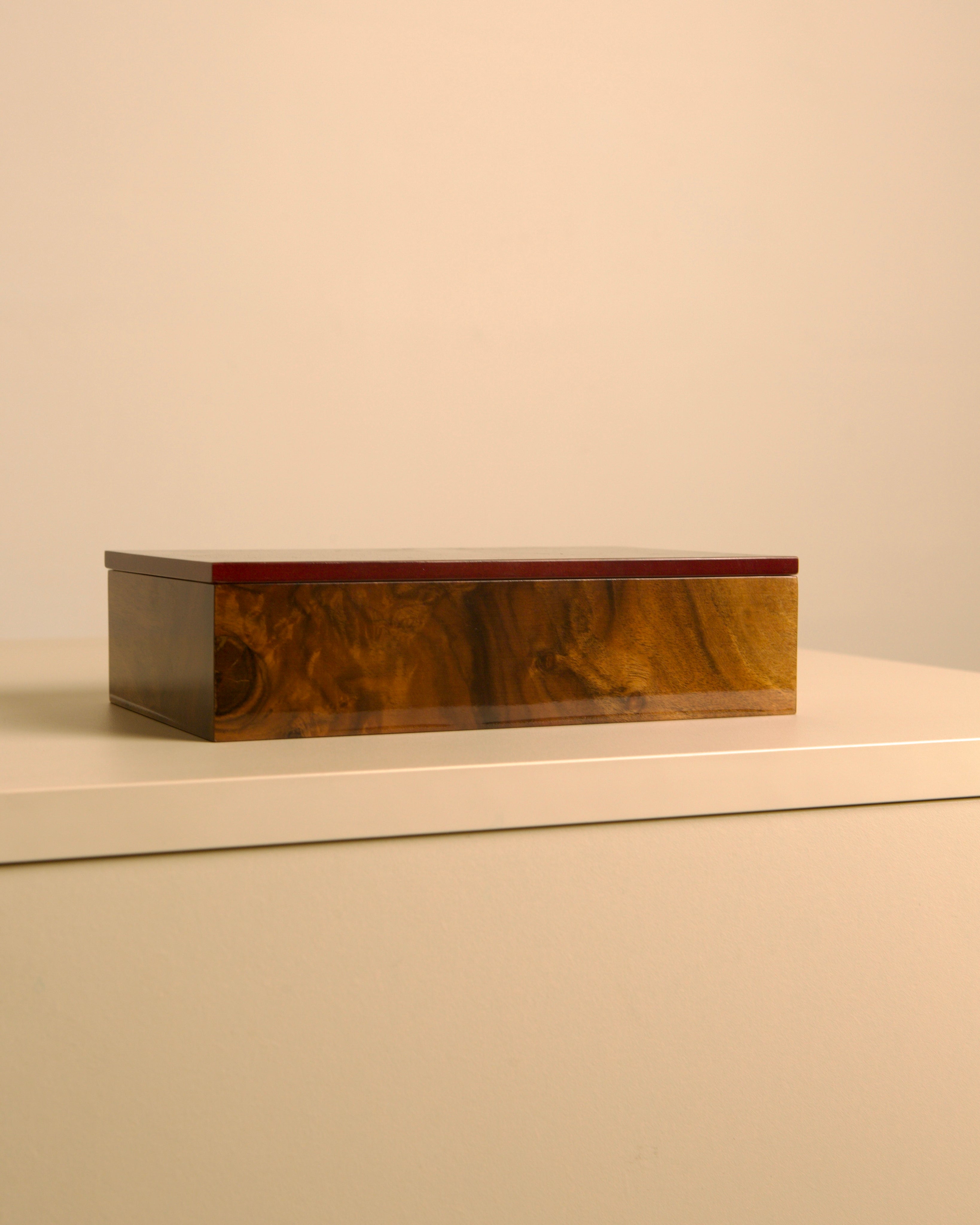Italian burr walnut box with red interior 80s — side angle on neutral surface