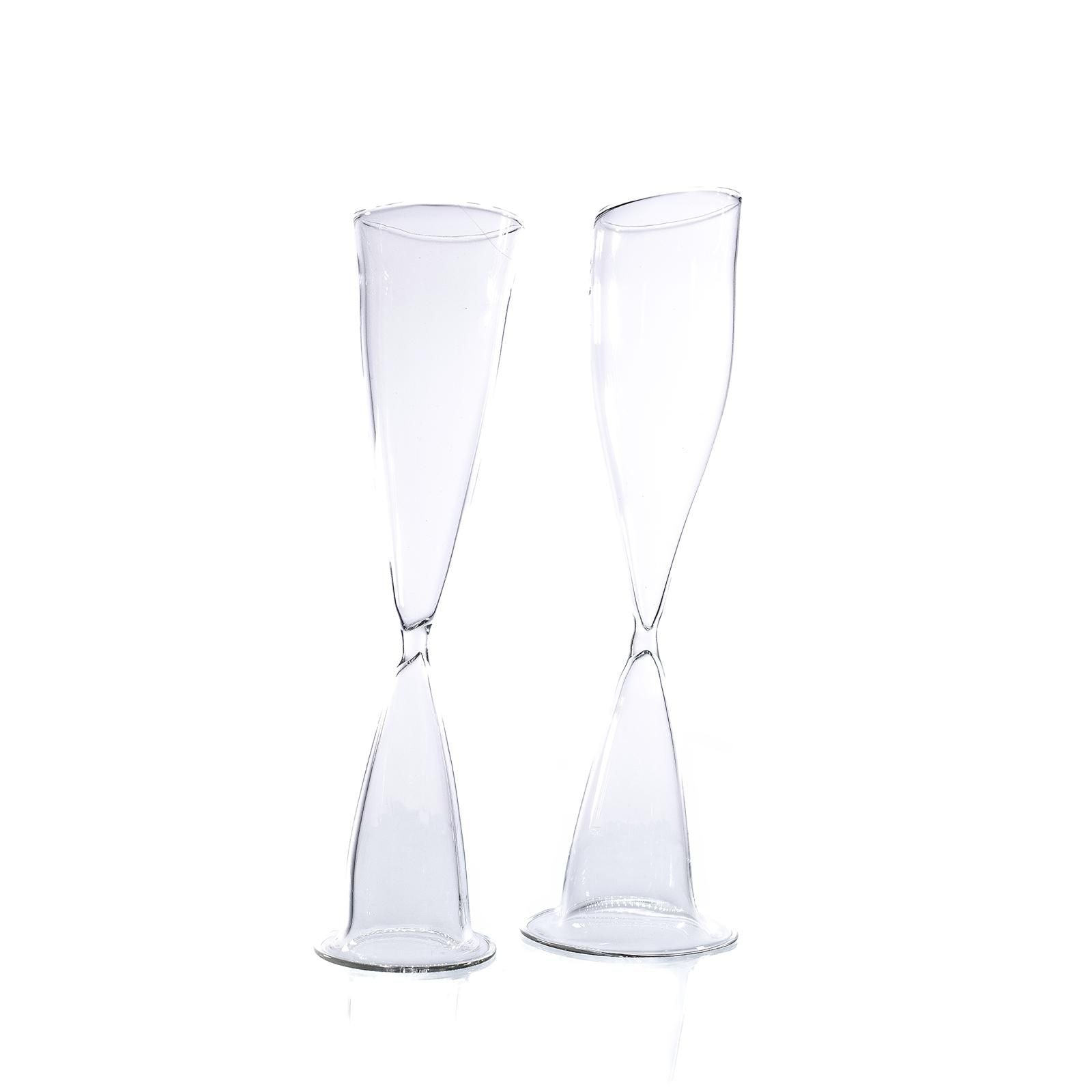 Two clear glass twisted champagne flutes by Agustina Ros detail