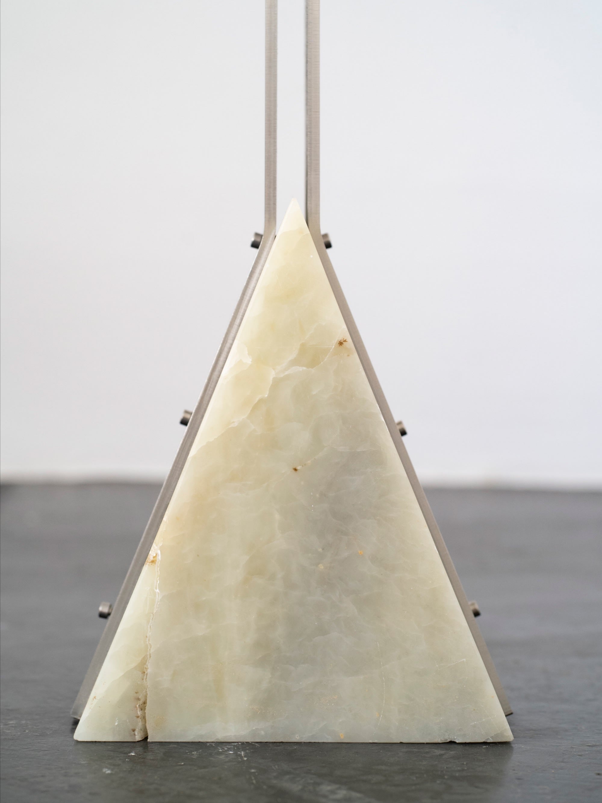 Triangle Floor Lamp | DN_S2502 — back view of alabaster base on dark floor