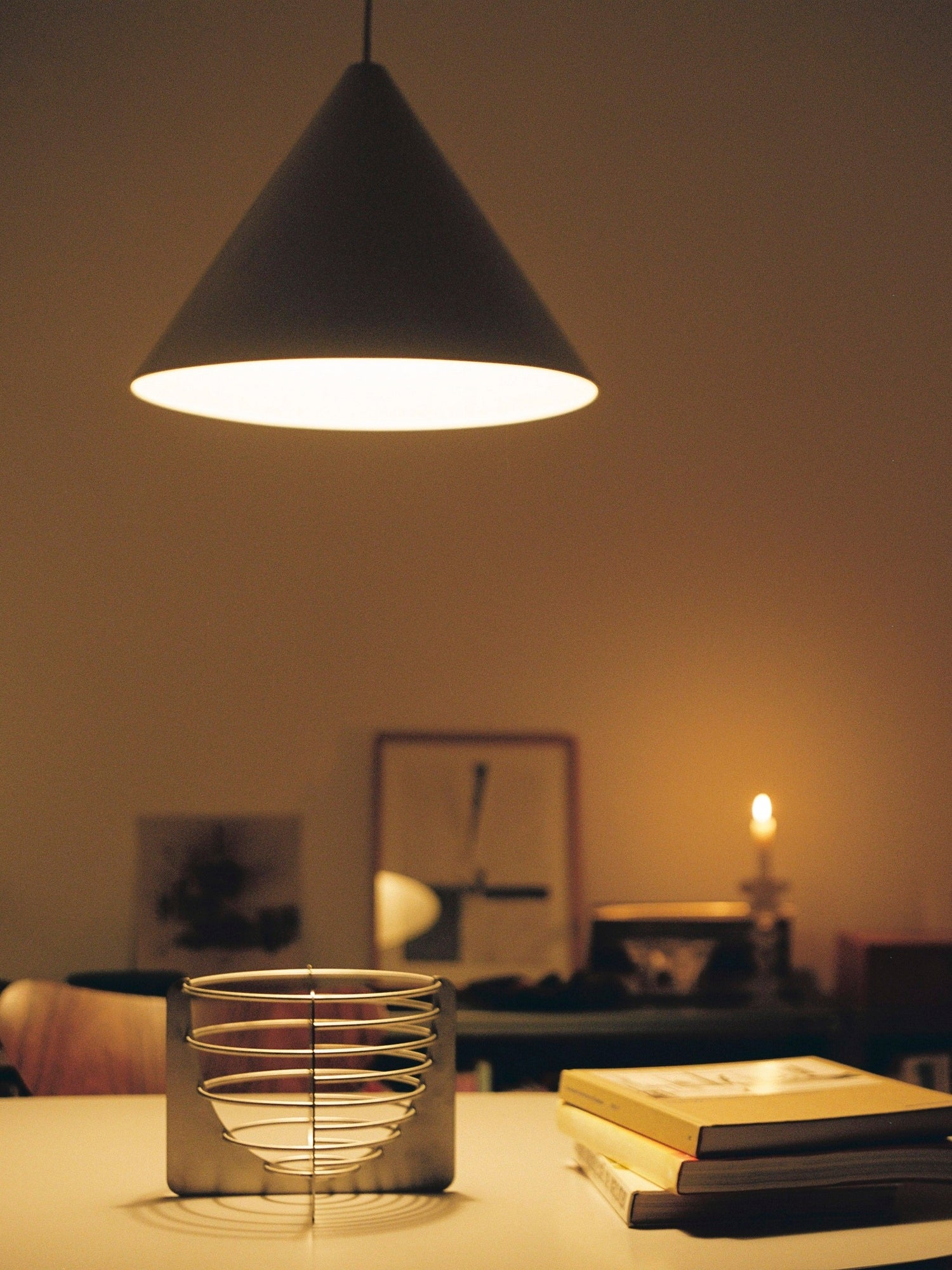 Draft Bowl — metal bowl on table with books and lamp