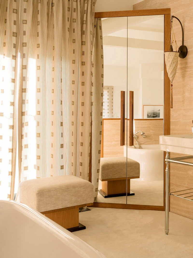 Sorbet Ottoman/stool in oak and lacquer — close-up in bathroom setting