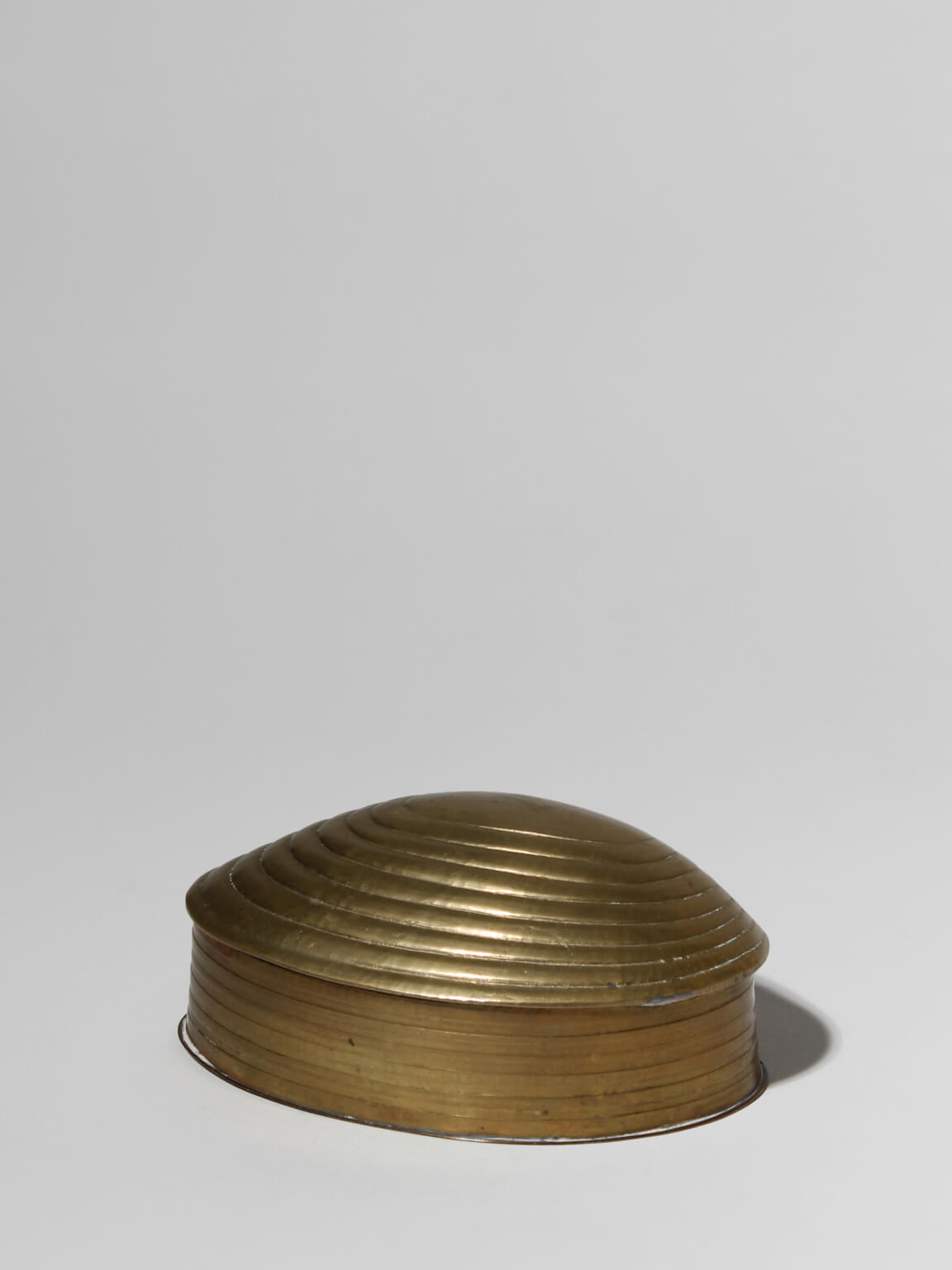 Brass Clamshell Trinket Box — side view on neutral background