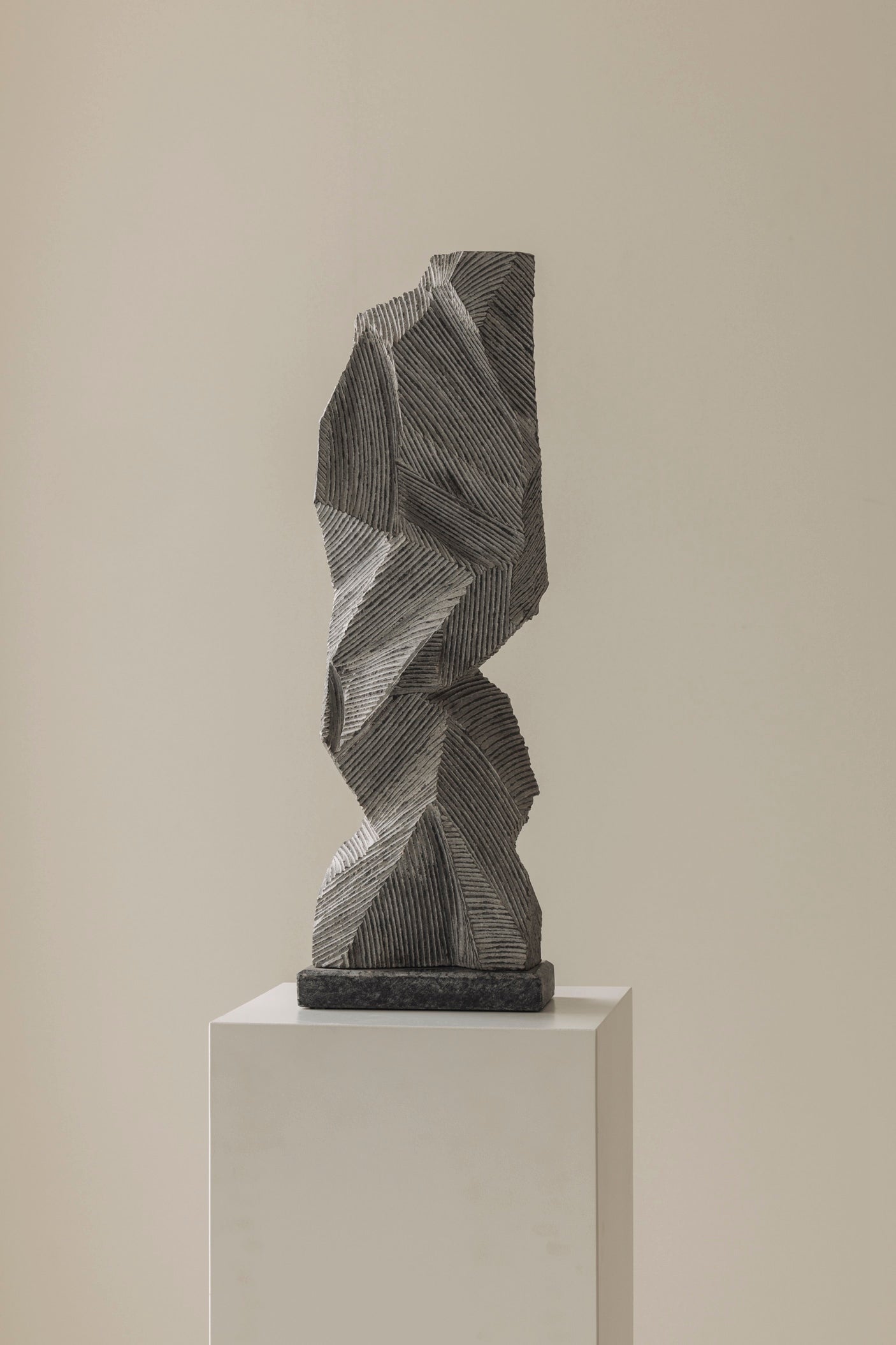 Abstract sculpture Carved from natural stone by Marc Verdoodt, Belgium 1980s. — lifestyle setting