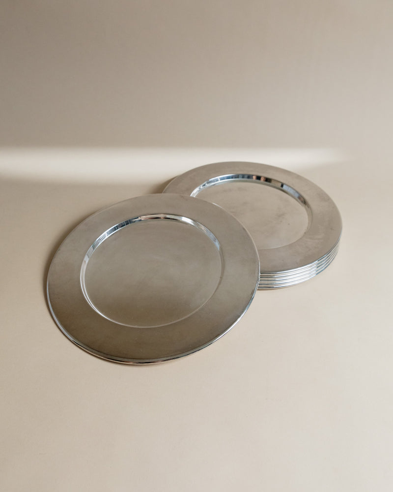 Set of elegant silver-rimmed underplates from 1970s Italy