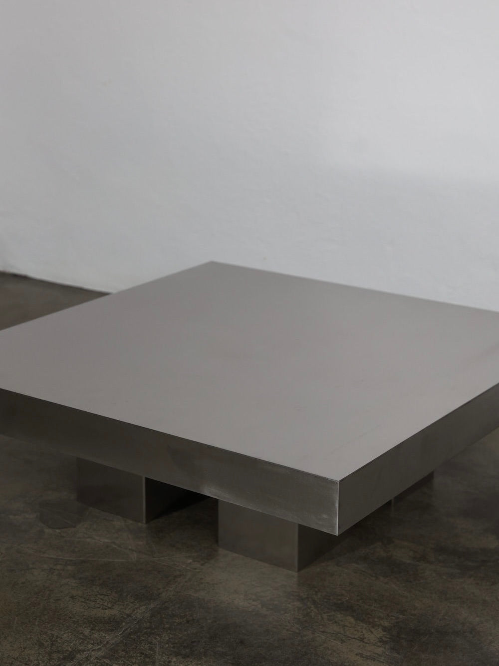 Block Coffee Table — side angle showing brushed metal finish