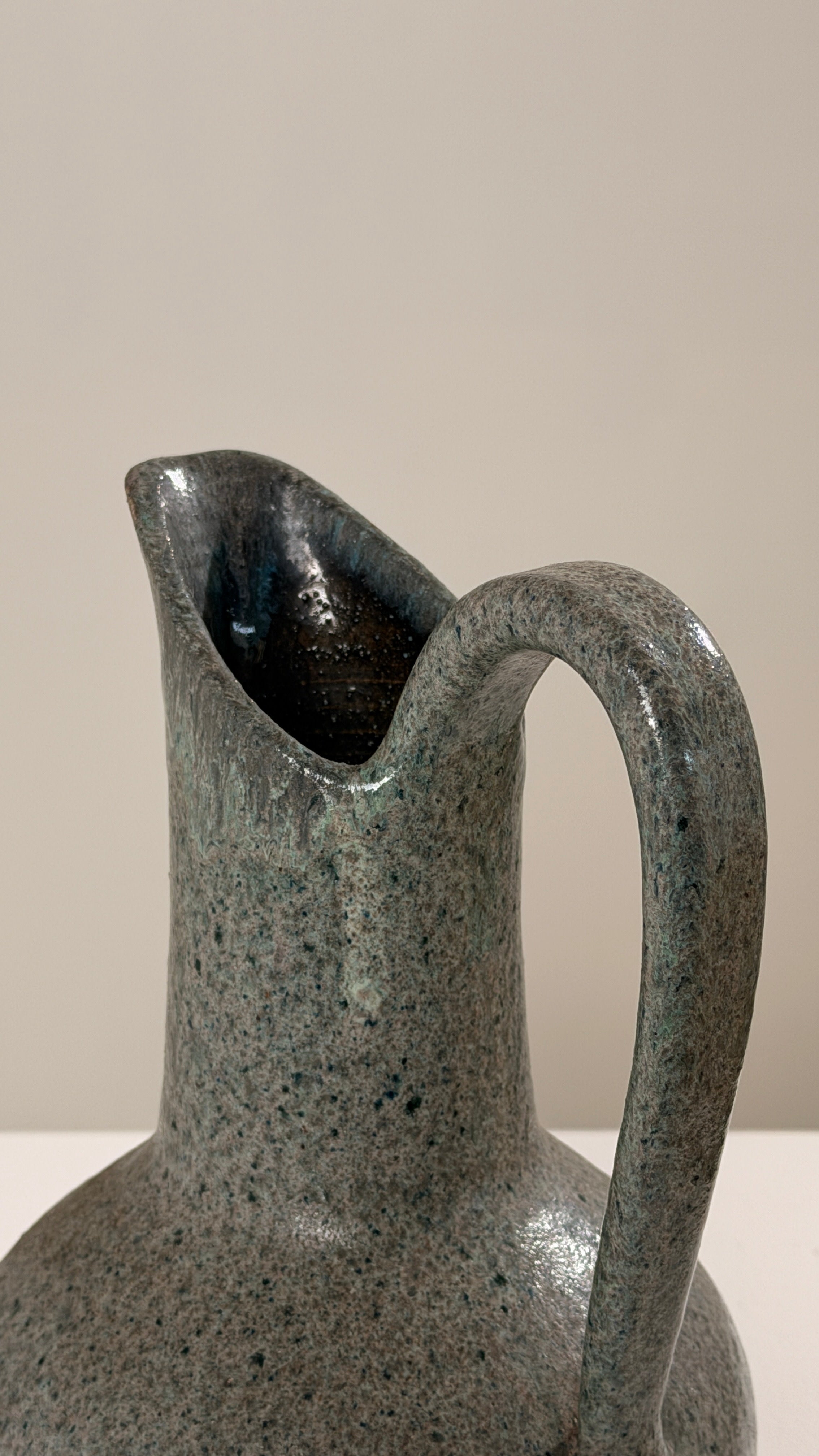 Ceramic Pitcher by Potiers d'Accolay, France, circa 1960 — side angle highlighting textured green glaze